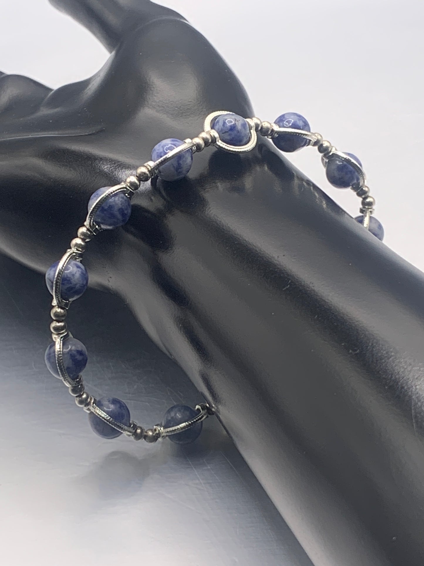 Blue dot jasper semi precious stone/crystal elastic beaded bracelet with silver colored rings