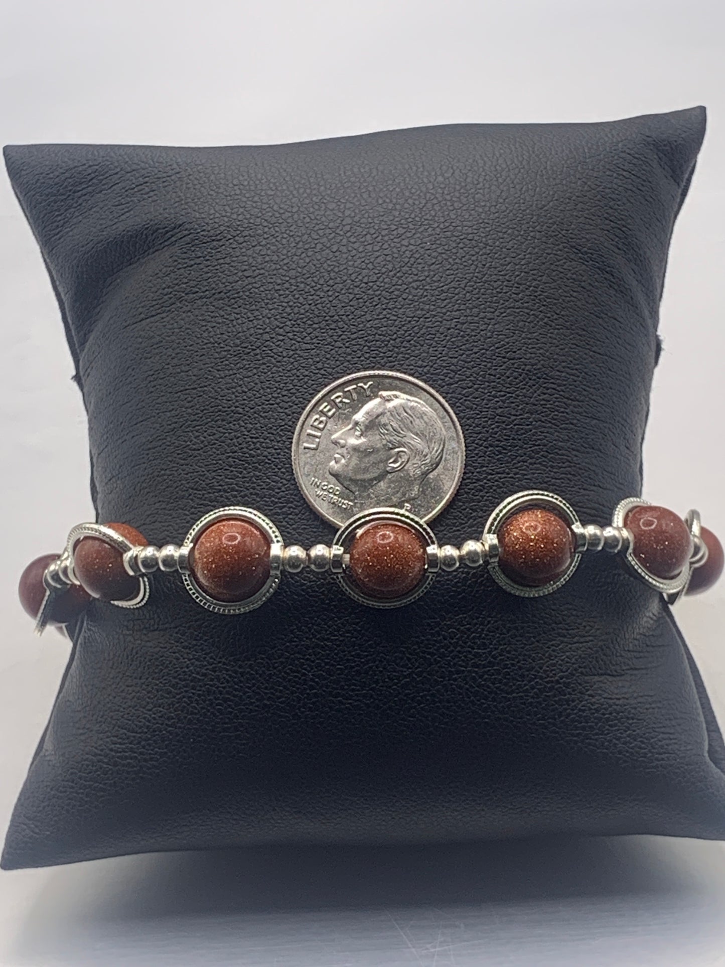 Sandstone semi precious stone/crystal elastic beaded bracelet with silver colored rings