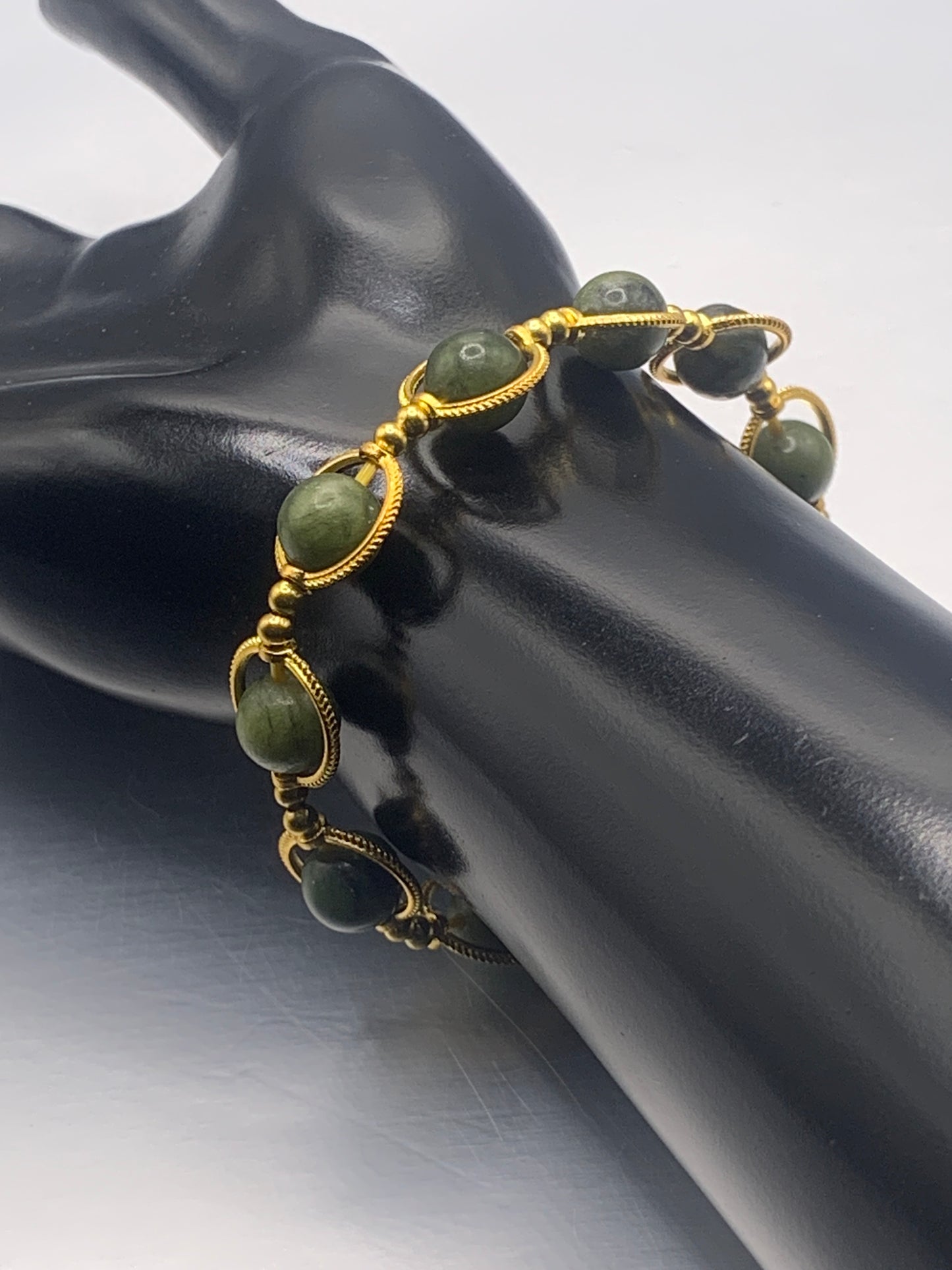 Green jade semi precious stone/crystal elastic beaded bracelet with gold colored rings