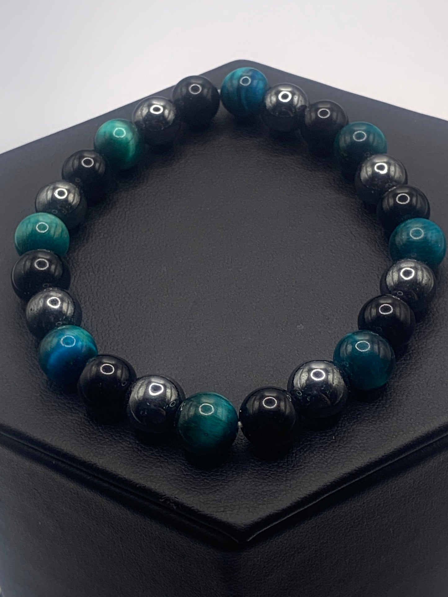 Hematite, black obsidian, and teal blue tigers eye semi precious stone/crystal elastic beaded bracelet