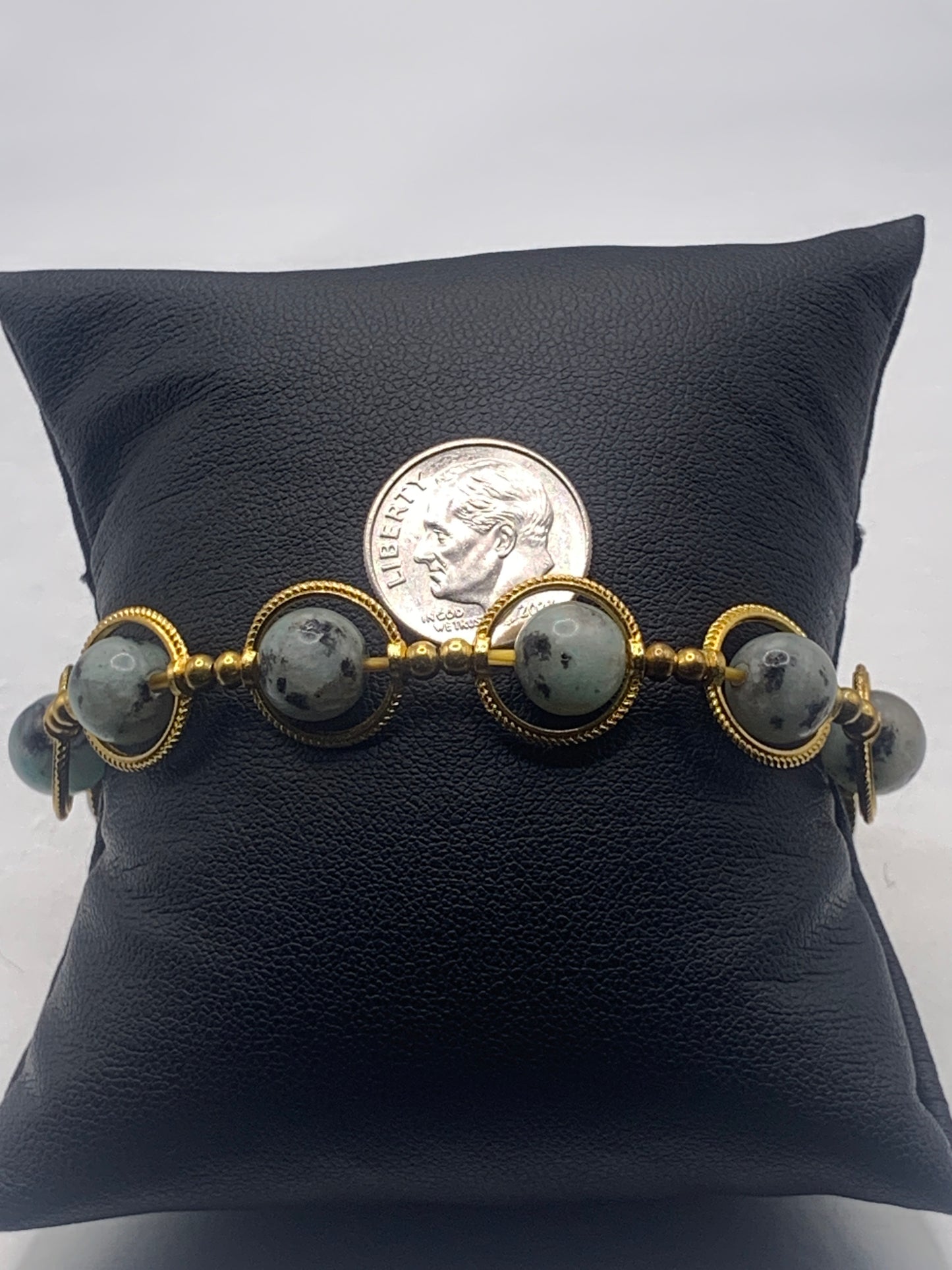Kiwi jasper semi precious stone/crystal elastic beaded bracelet with gold colored rings