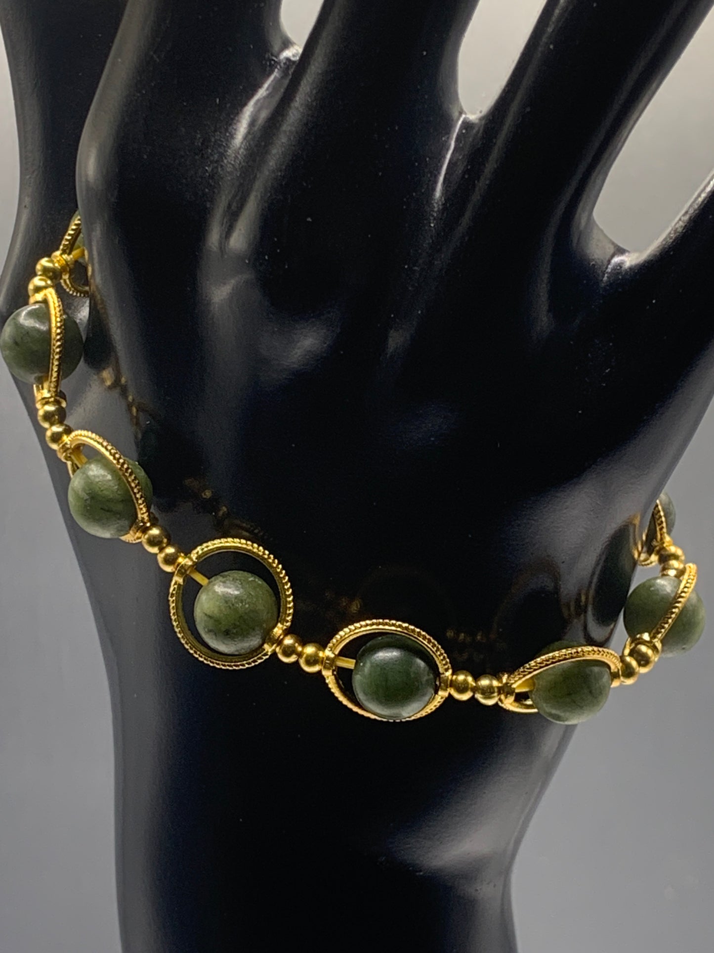 Green jade semi precious stone/crystal elastic beaded bracelet with gold colored rings
