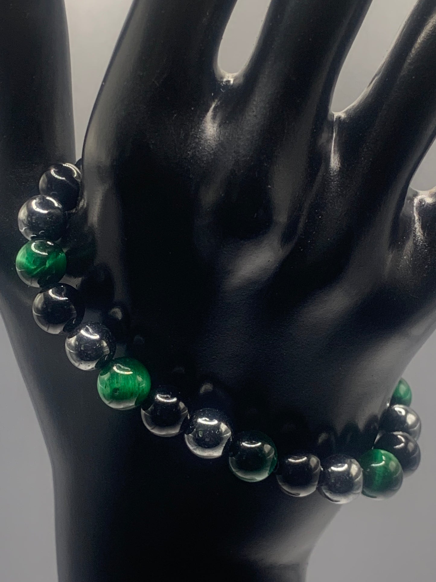 Hematite, black obsidian, and green tigers eye semi precious stone/crystal elastic beaded bracelet