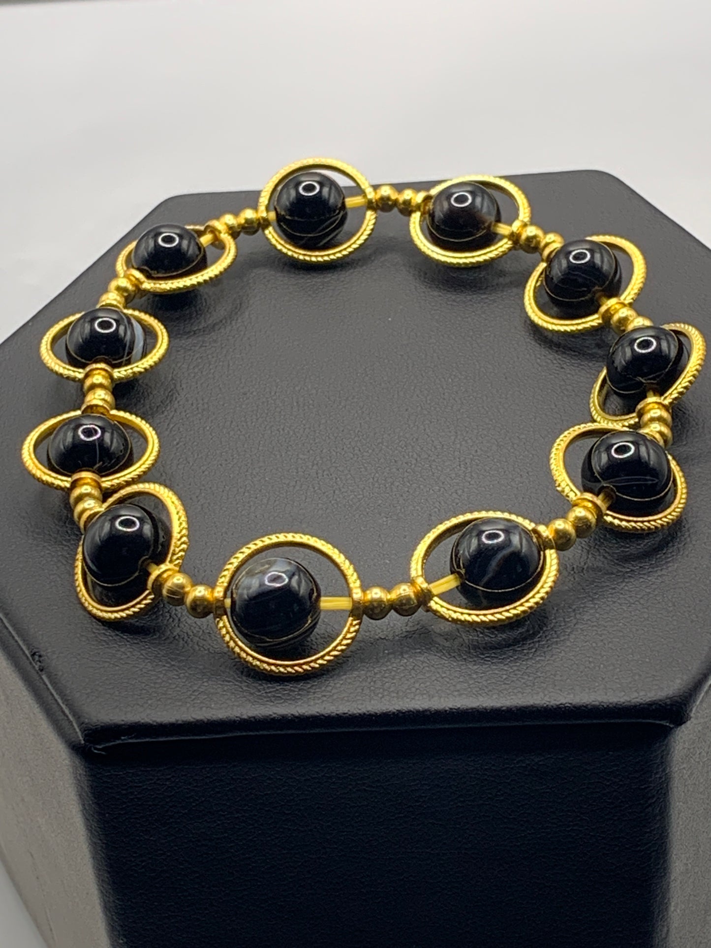 Black lace agate semi precious stone/crystal elastic beaded bracelet with gold colored rings
