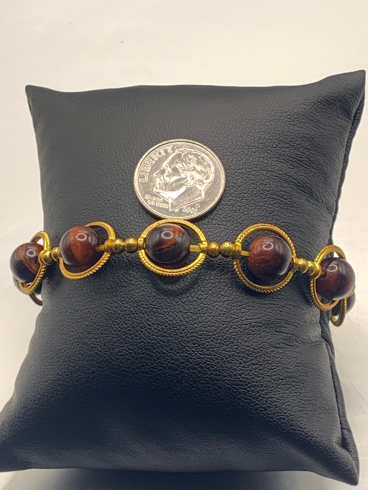 Red tigers eye semi precious stone/crystal elastic beaded bracelet with gold colored rings