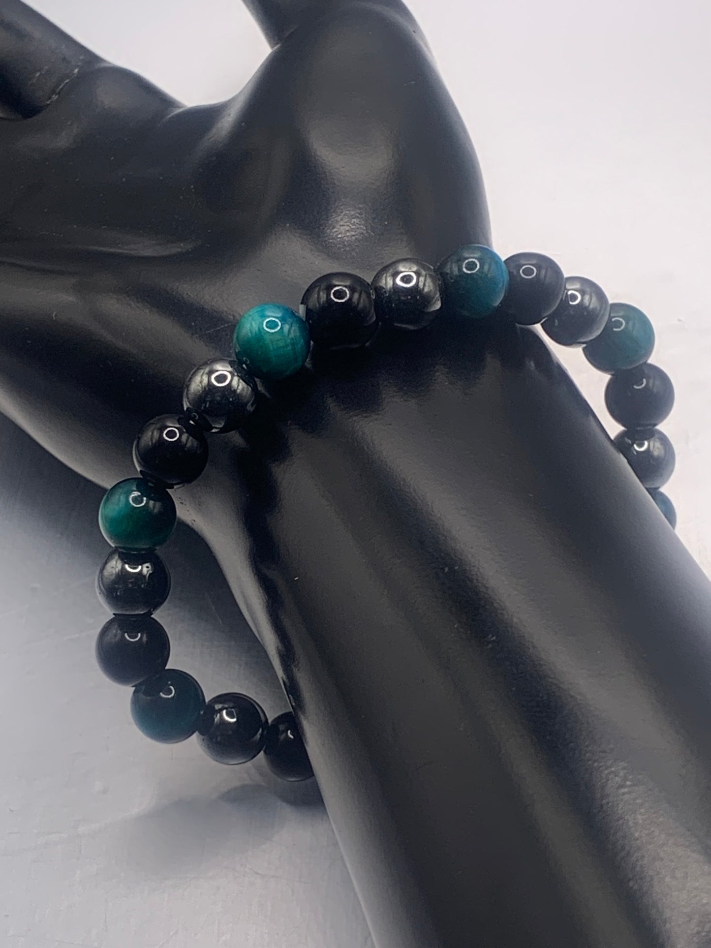 Hematite, black obsidian, and teal blue tigers eye semi precious stone/crystal elastic beaded bracelet