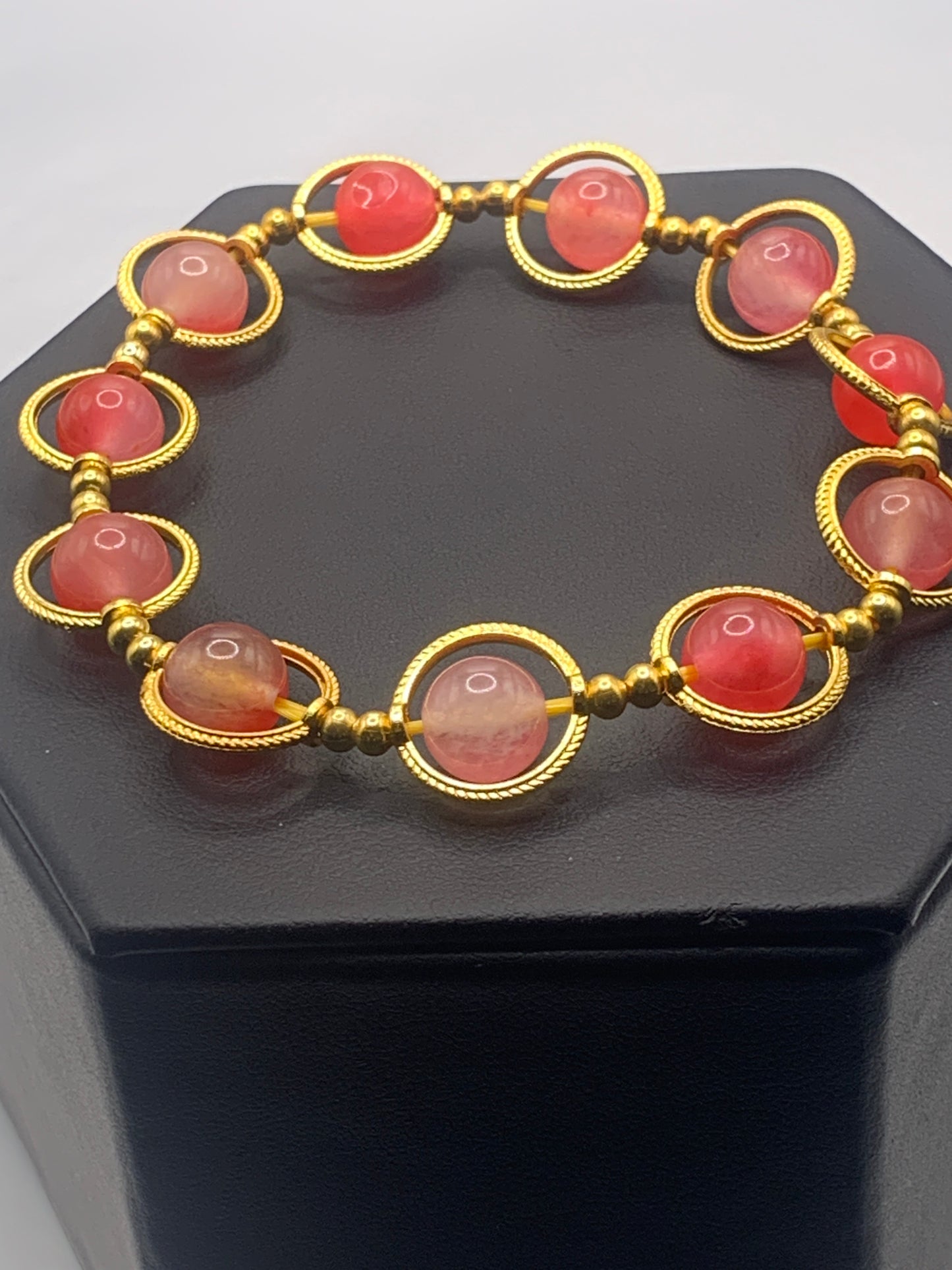Hot pink agate semi precious stone/crystal elastic beaded bracelet with gold colored rings