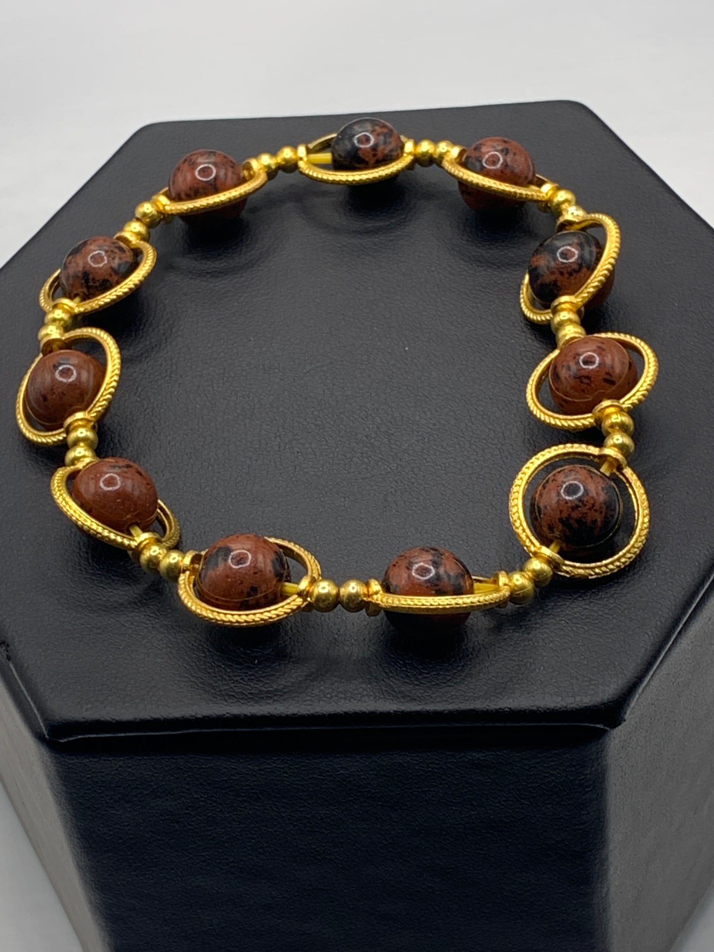 Mahogany jasper semi precious stone/crystal elastic beaded bracelet with gold colored rings