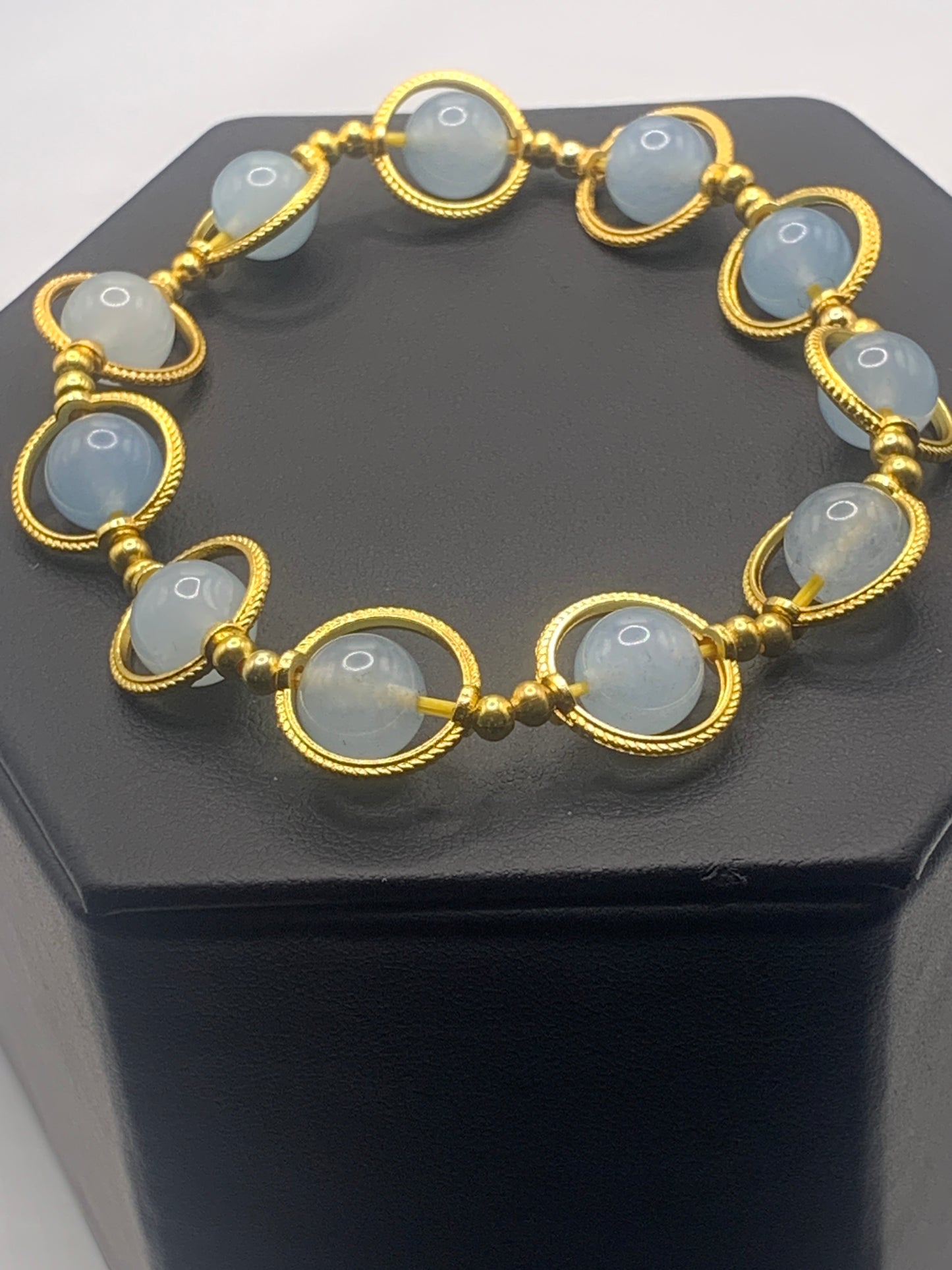 Blue agate semi precious stone/crystal elastic beaded bracelet with gold colored rings