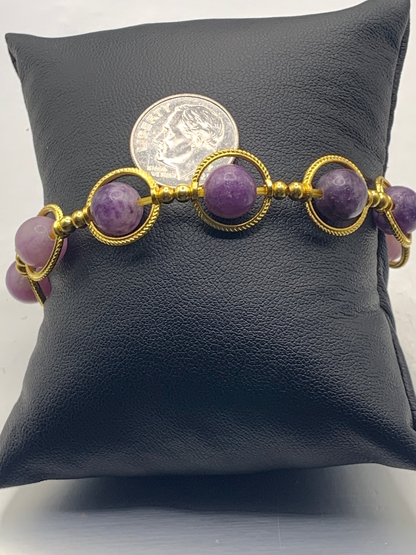 Purple mica semi precious stone/crystal elastic beaded bracelet with gold colored rings