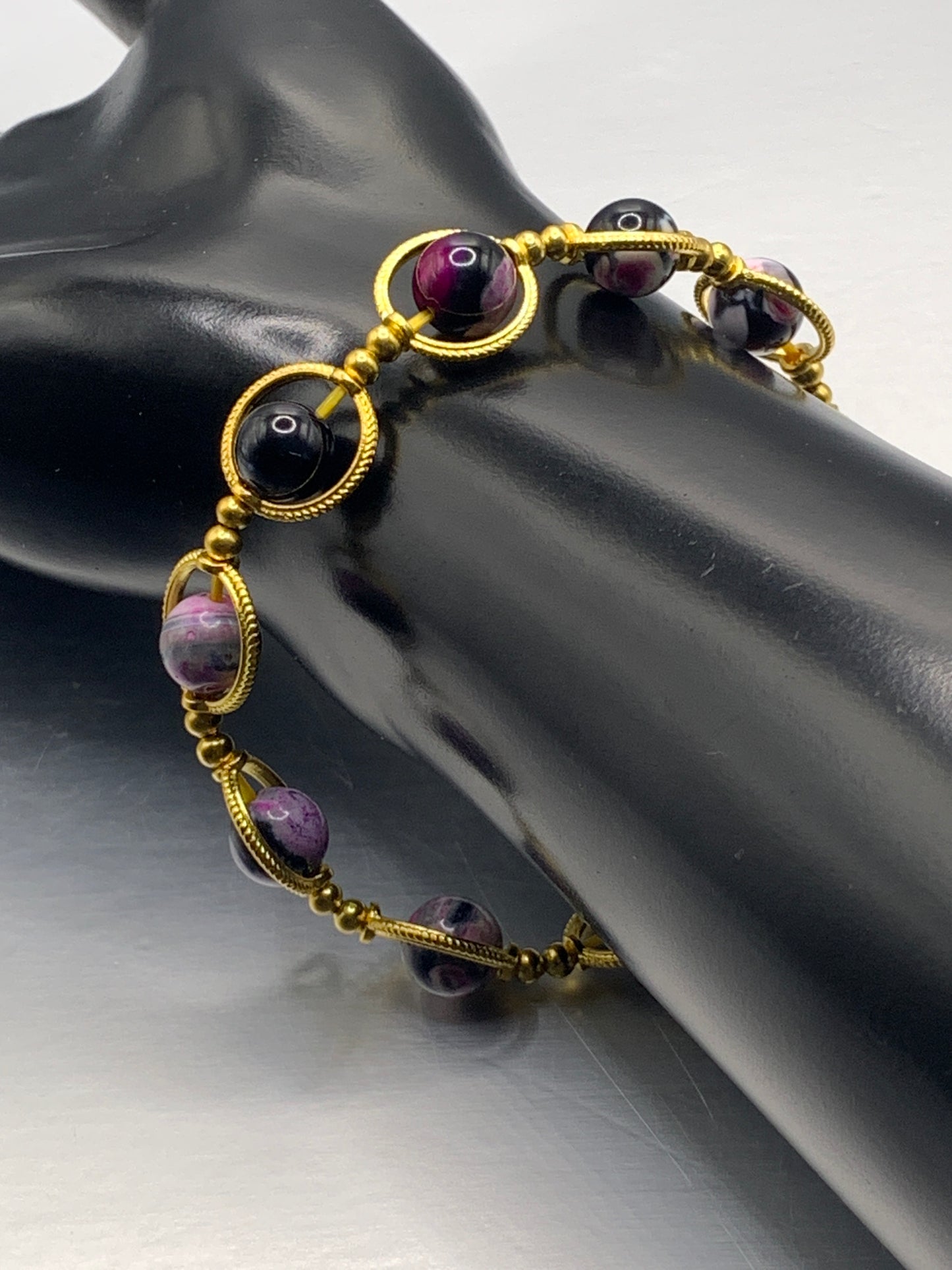 Pink orca agate semi precious stone/crystal elastic beaded bracelet with gold colored rings