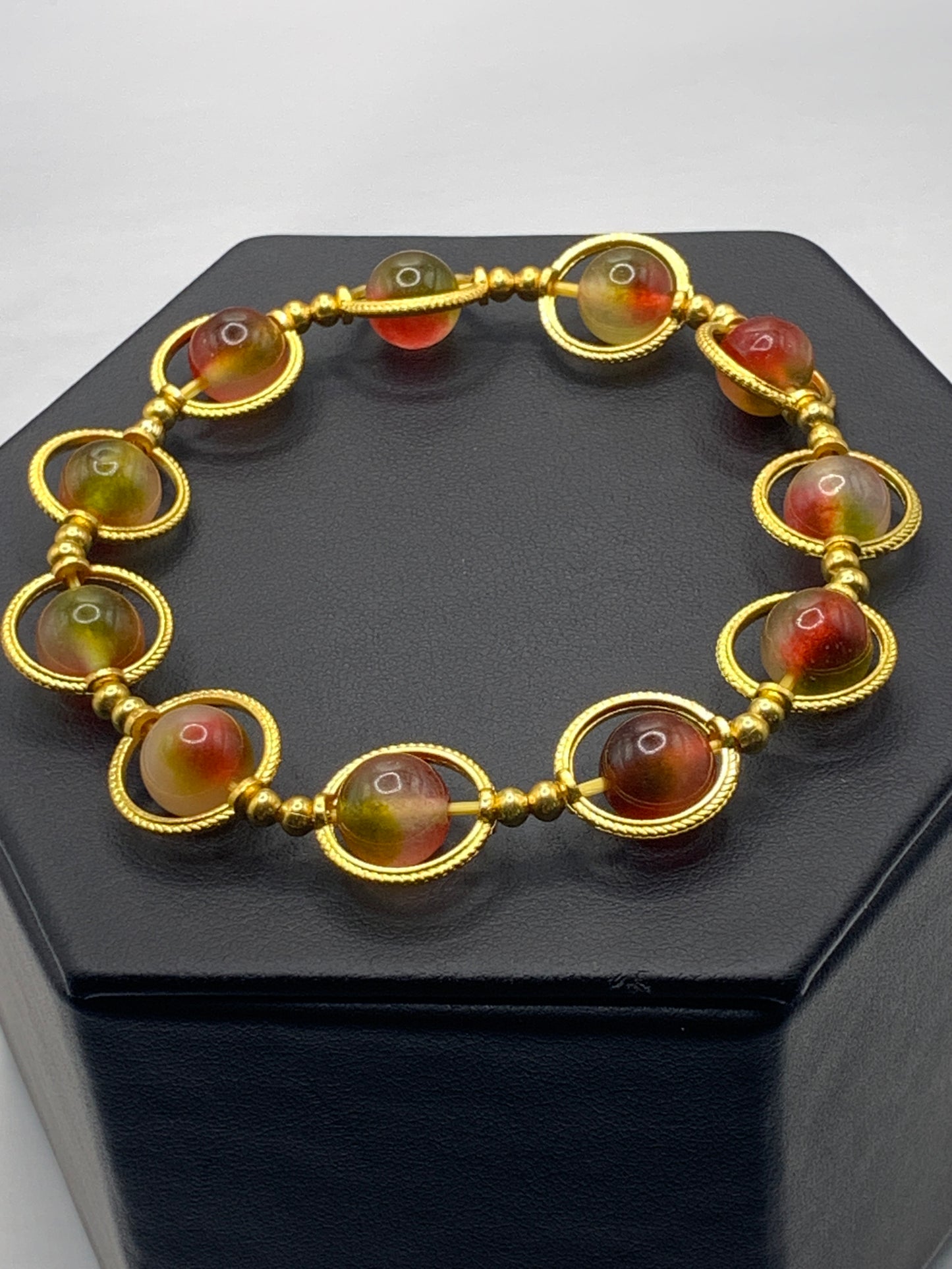 Watermelon chalcedony semi precious stone/crystal elastic beaded bracelet with gold colored rings