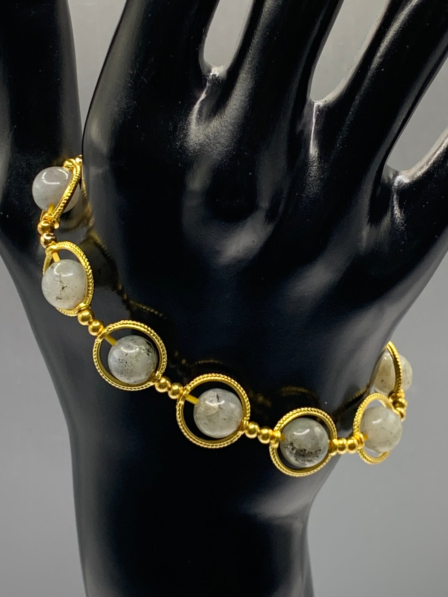 Labradorite semi precious stone/crystal elastic beaded bracelet with gold colored rings