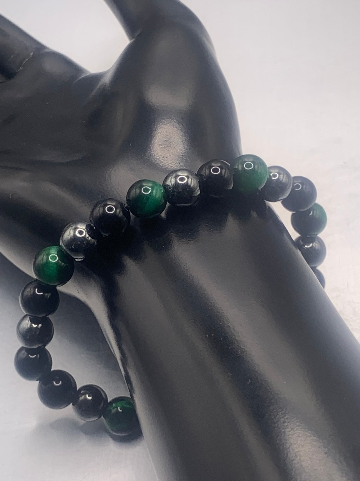 Hematite, black obsidian, and green tigers eye semi precious stone/crystal elastic beaded bracelet