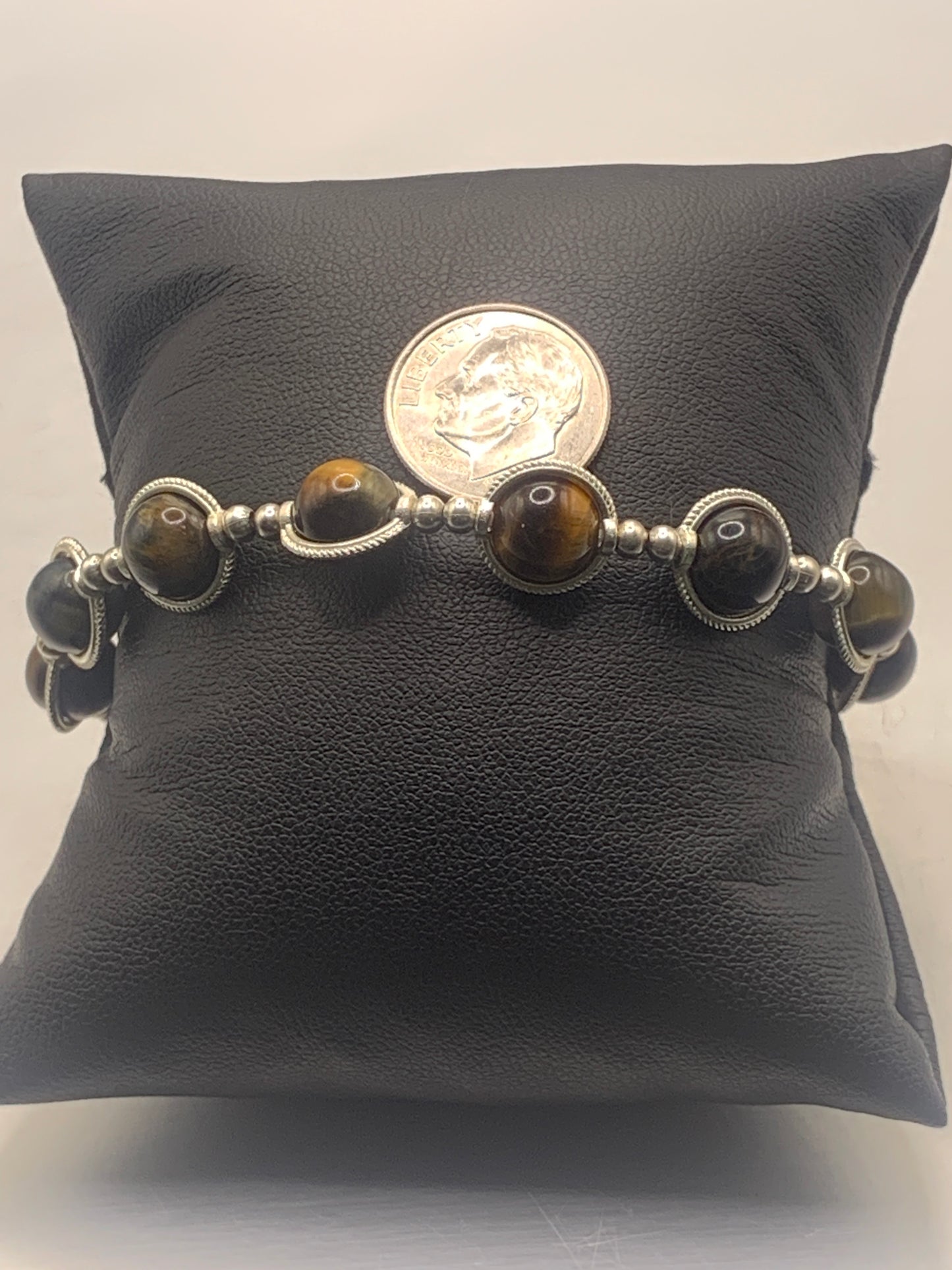 Tigers eye semi precious stone/crystal elastic beaded bracelet with silver colored rings