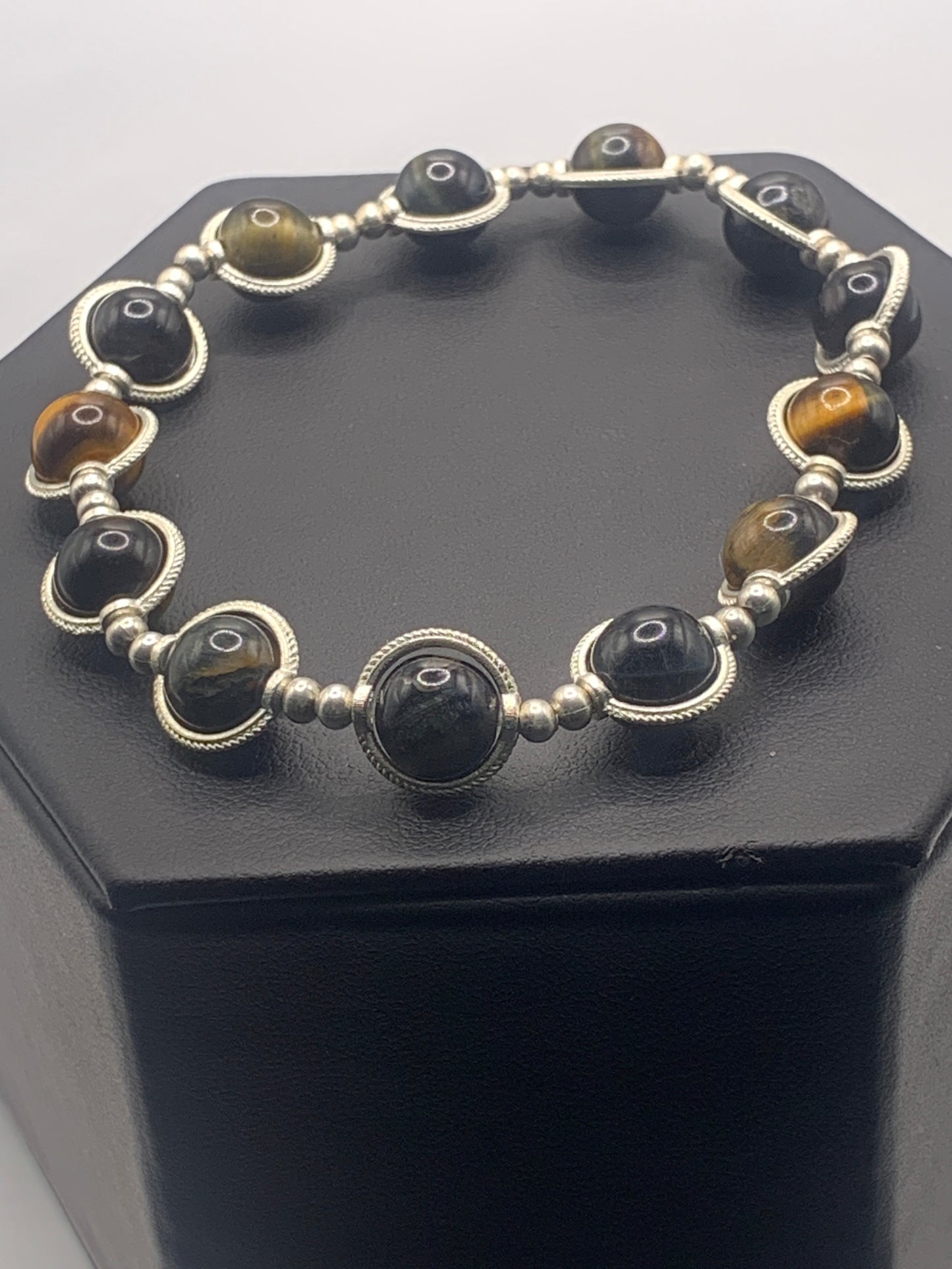 Tigers eye semi precious stone/crystal elastic beaded bracelet with silver colored rings