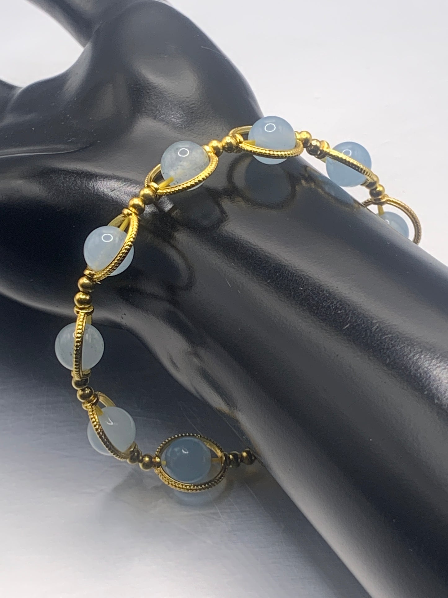 Blue agate semi precious stone/crystal elastic beaded bracelet with gold colored rings