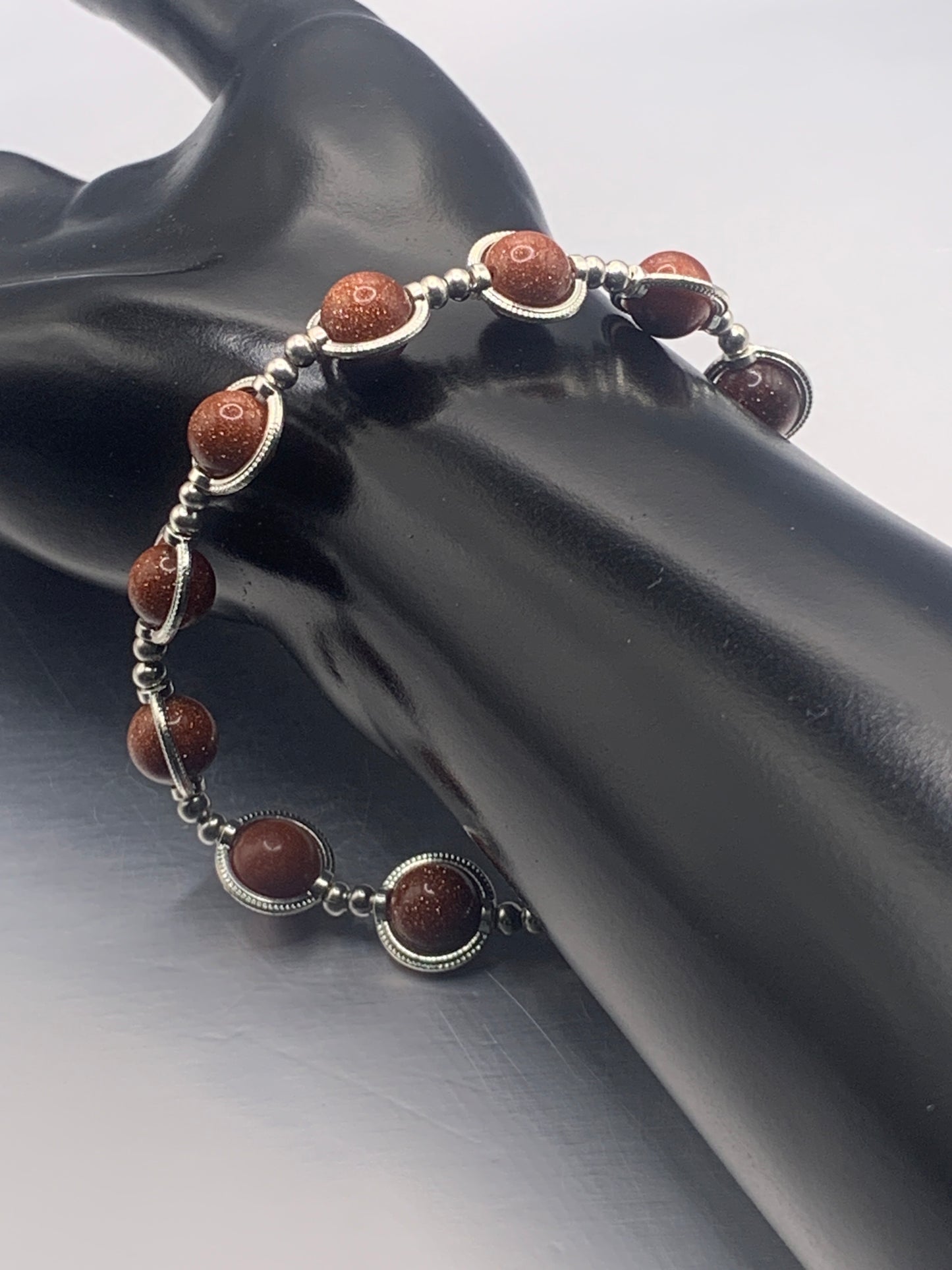 Sandstone semi precious stone/crystal elastic beaded bracelet with silver colored rings