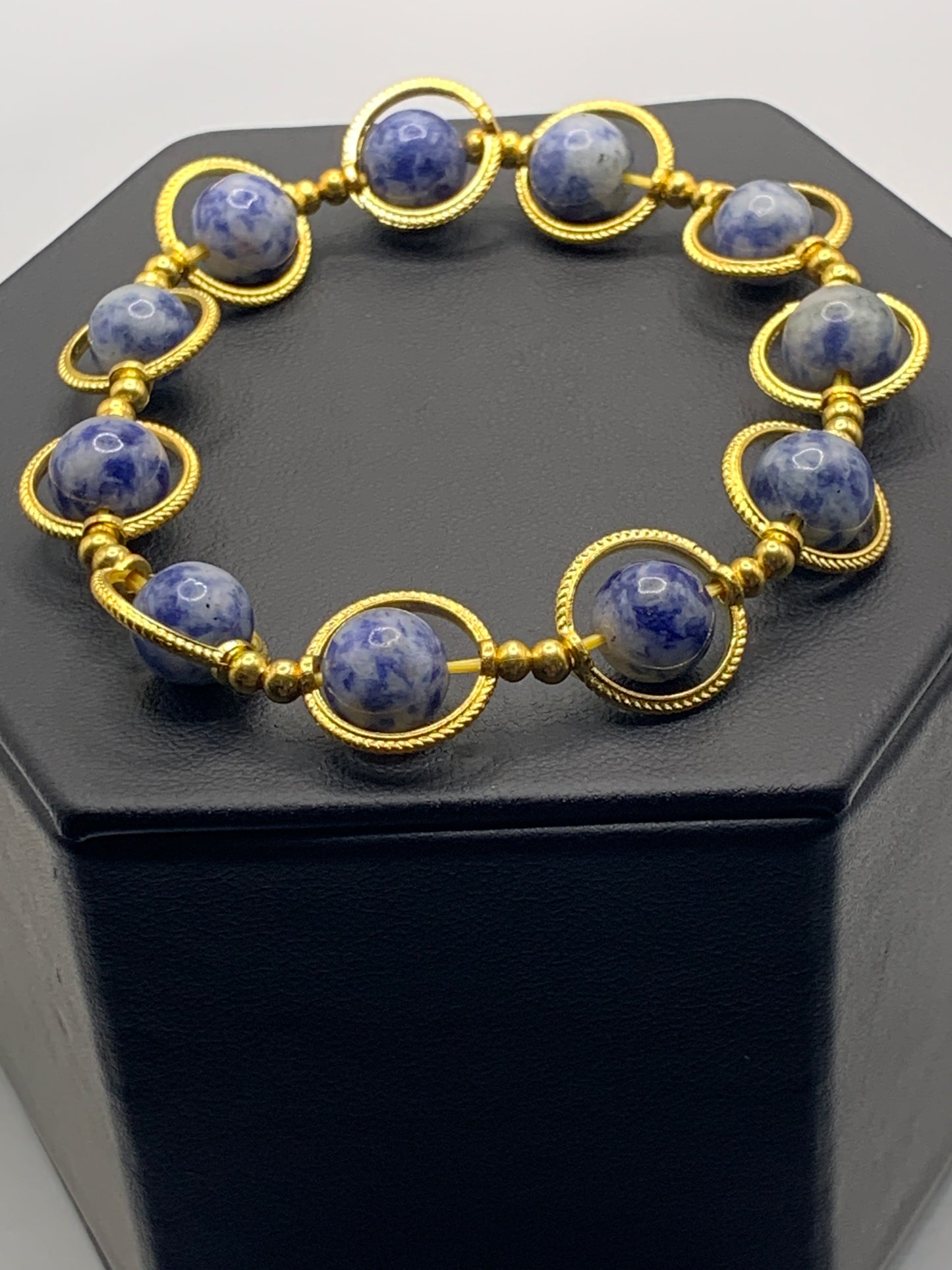 Blue dot jasper semi precious stone/crystal elastic beaded bracelet with gold colored rings
