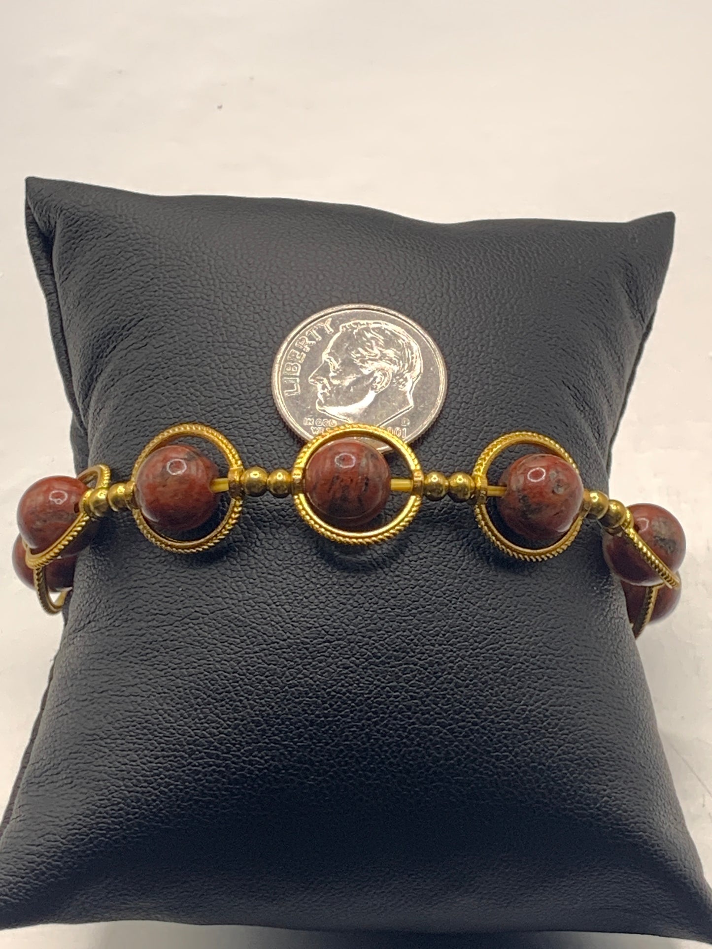 Red sesame jasper semi precious stone/crystal elastic beaded bracelet with gold colored rings
