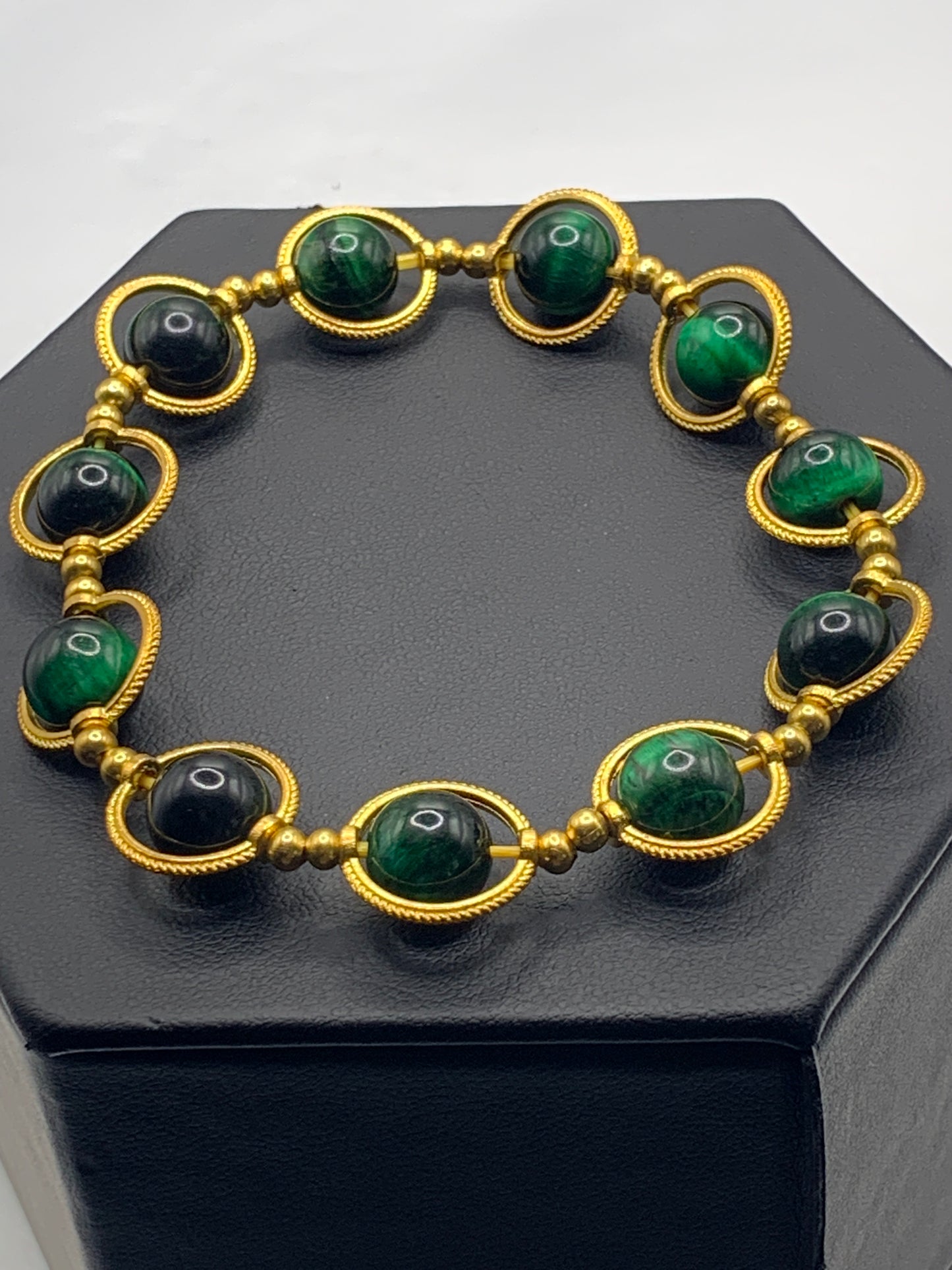 Green tigers eye semi precious stone/crystal elastic beaded bracelet with gold colored rings