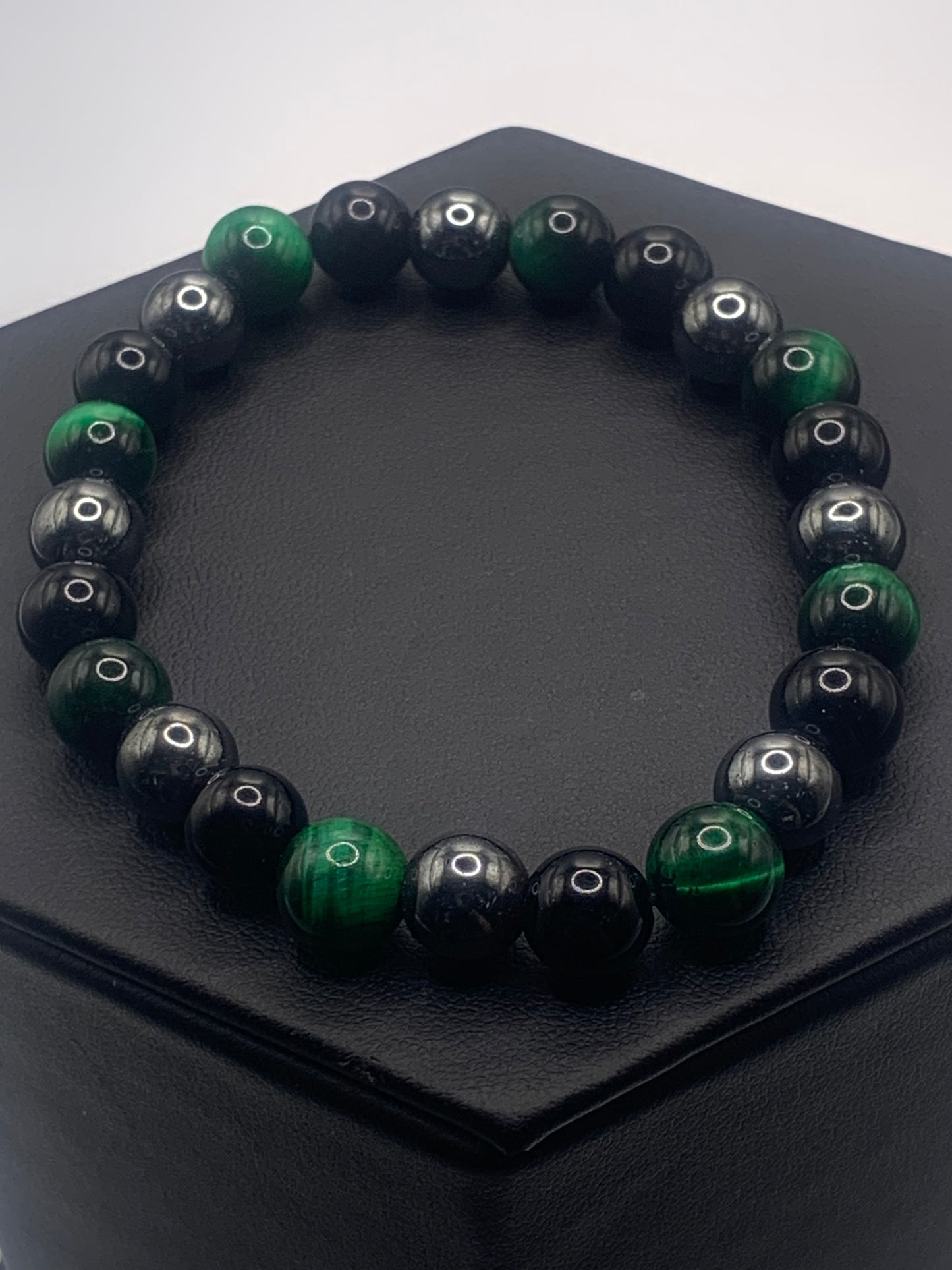 Hematite, black obsidian, and green tigers eye semi precious stone/crystal elastic beaded bracelet