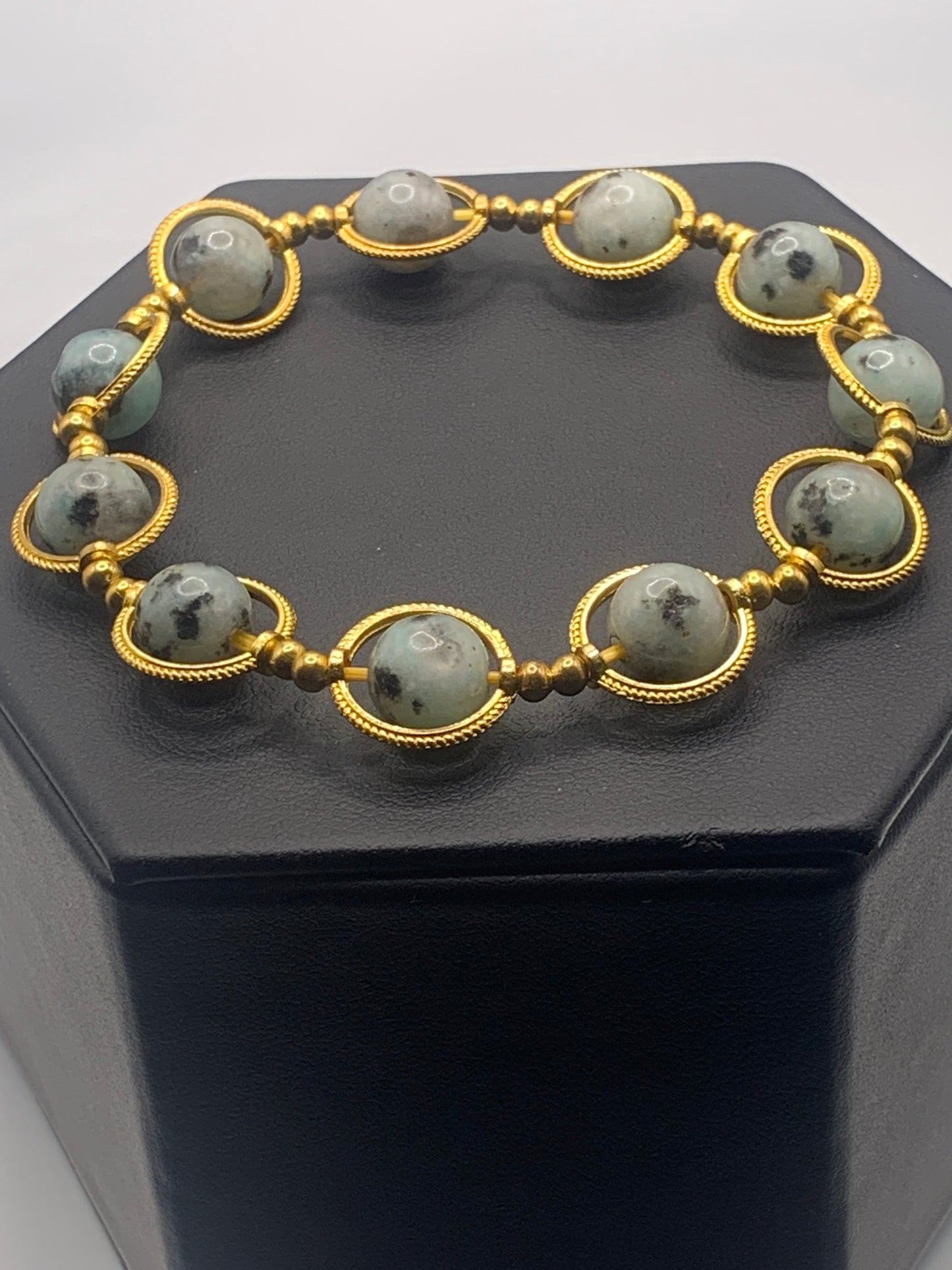 Kiwi jasper semi precious stone/crystal elastic beaded bracelet with gold colored rings