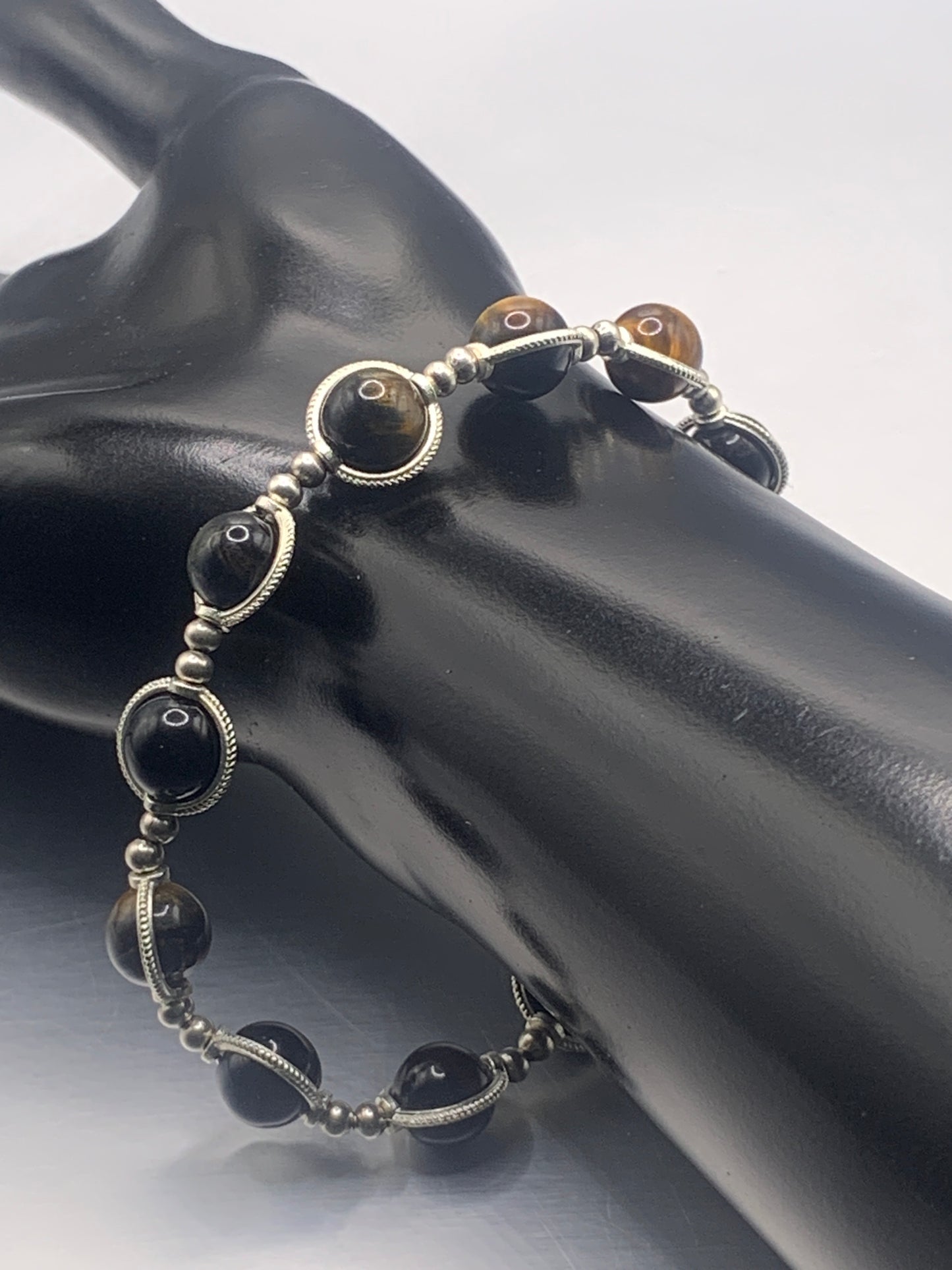 Tigers eye semi precious stone/crystal elastic beaded bracelet with silver colored rings