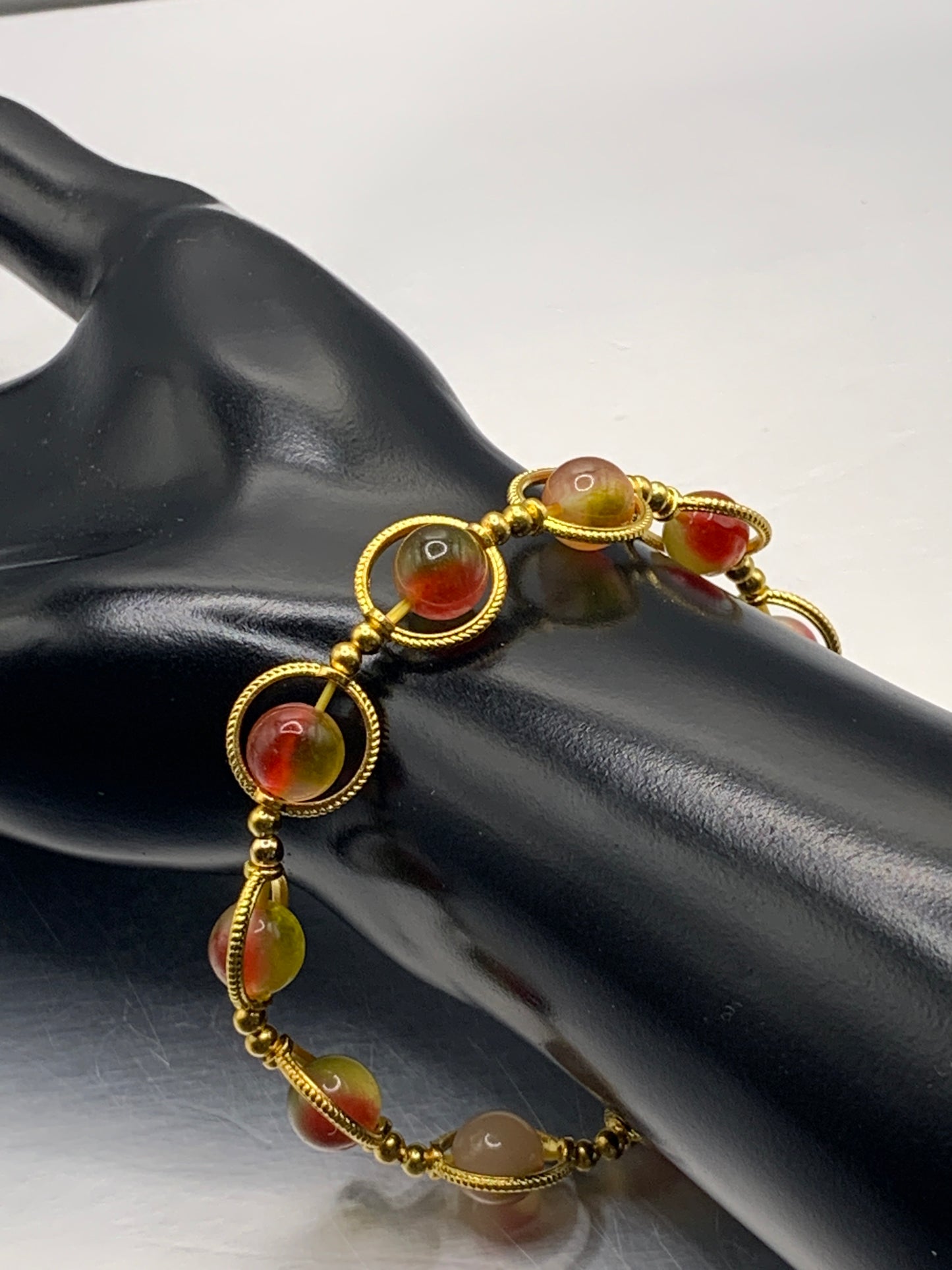 Watermelon chalcedony semi precious stone/crystal elastic beaded bracelet with gold colored rings