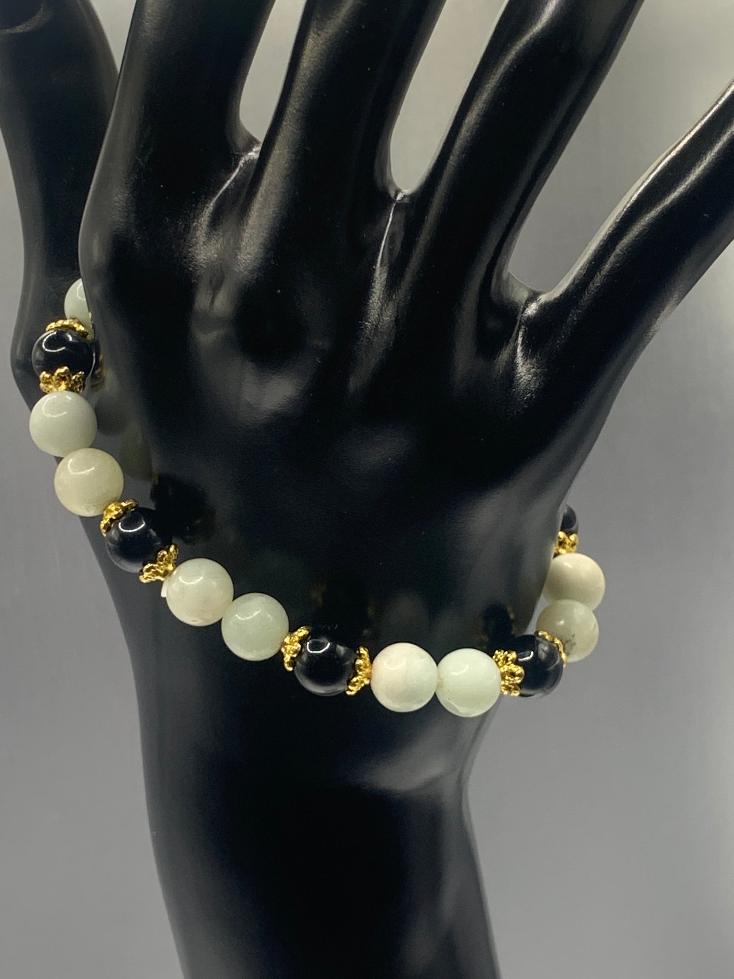 Black obsidian with amazonite semi precious stone/crystal beaded elastic bracelet with gold plated flower bead caps