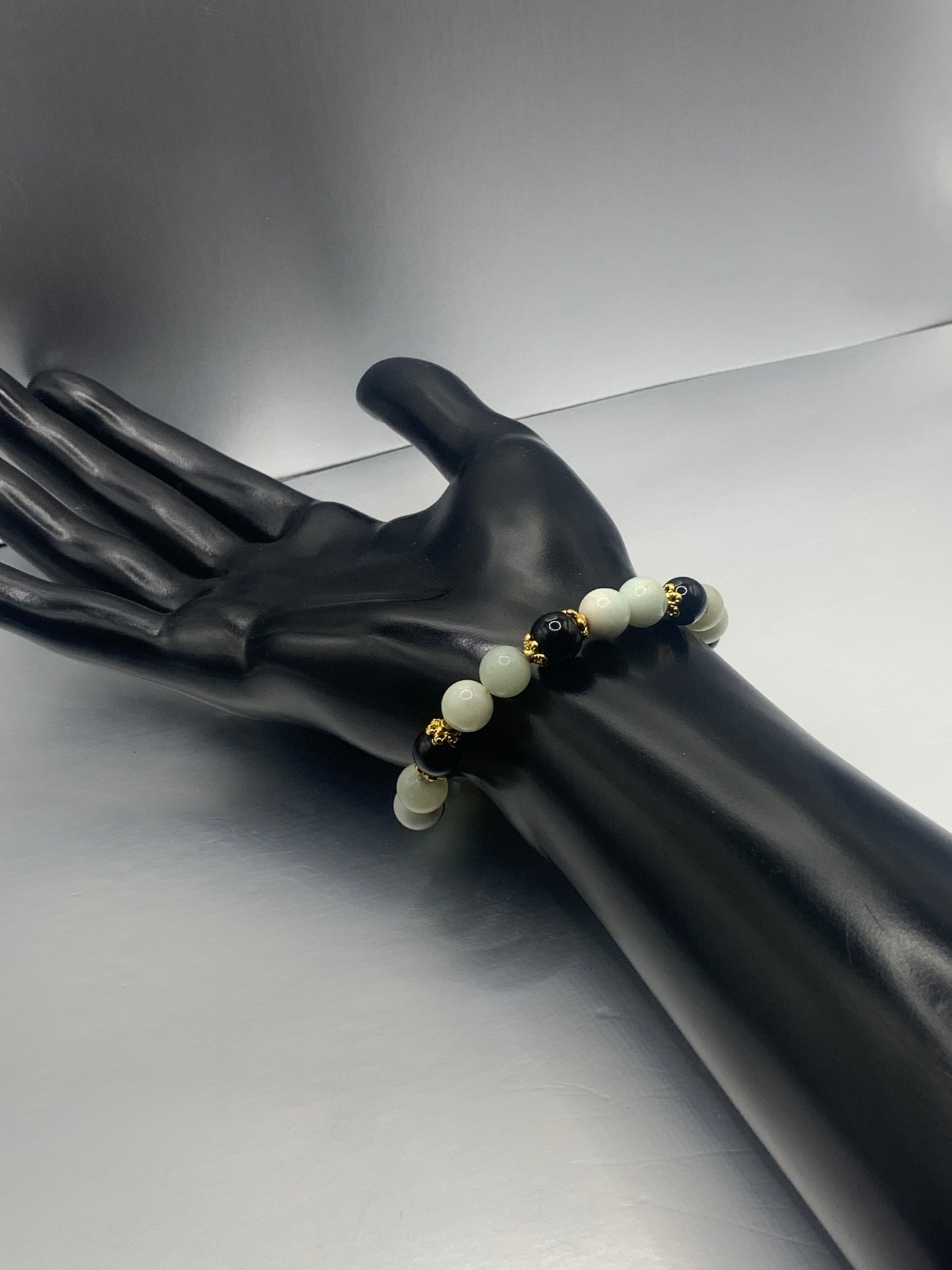 Black obsidian with amazonite semi precious stone/crystal beaded elastic bracelet with gold plated flower bead caps