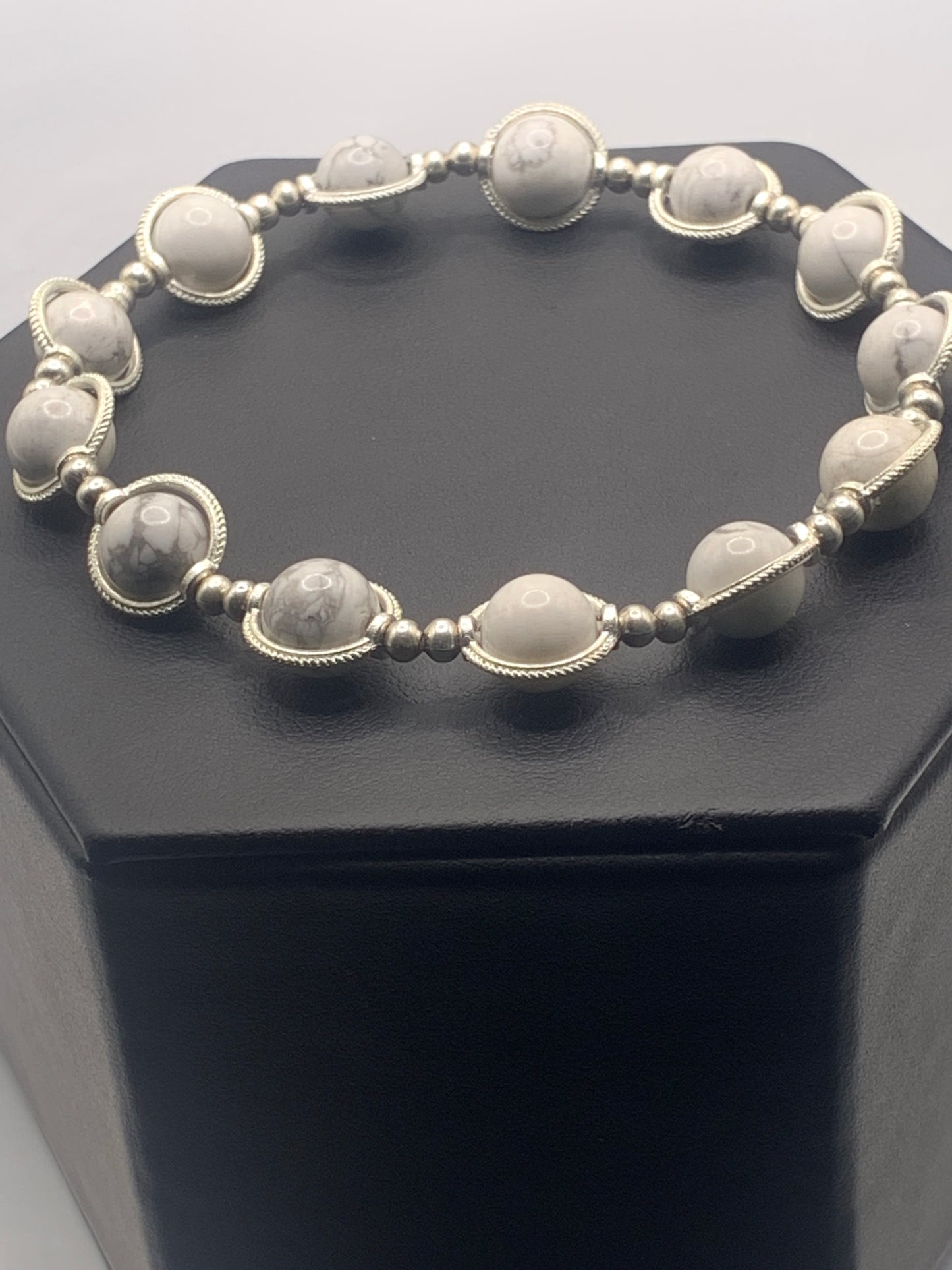 Howlite semi precious stone/crystal elastic beaded bracelet with silver colored rings
