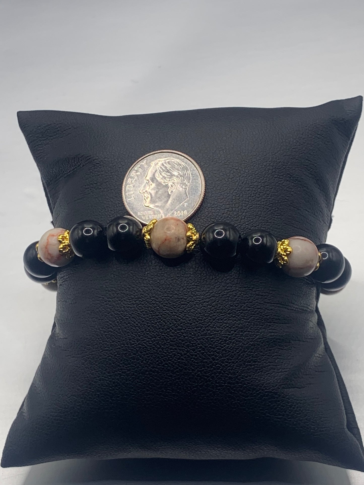 Red vein jasper and black obsidian semi precious stone/crystal elastic beaded bracelet with gold plated flower bead caps