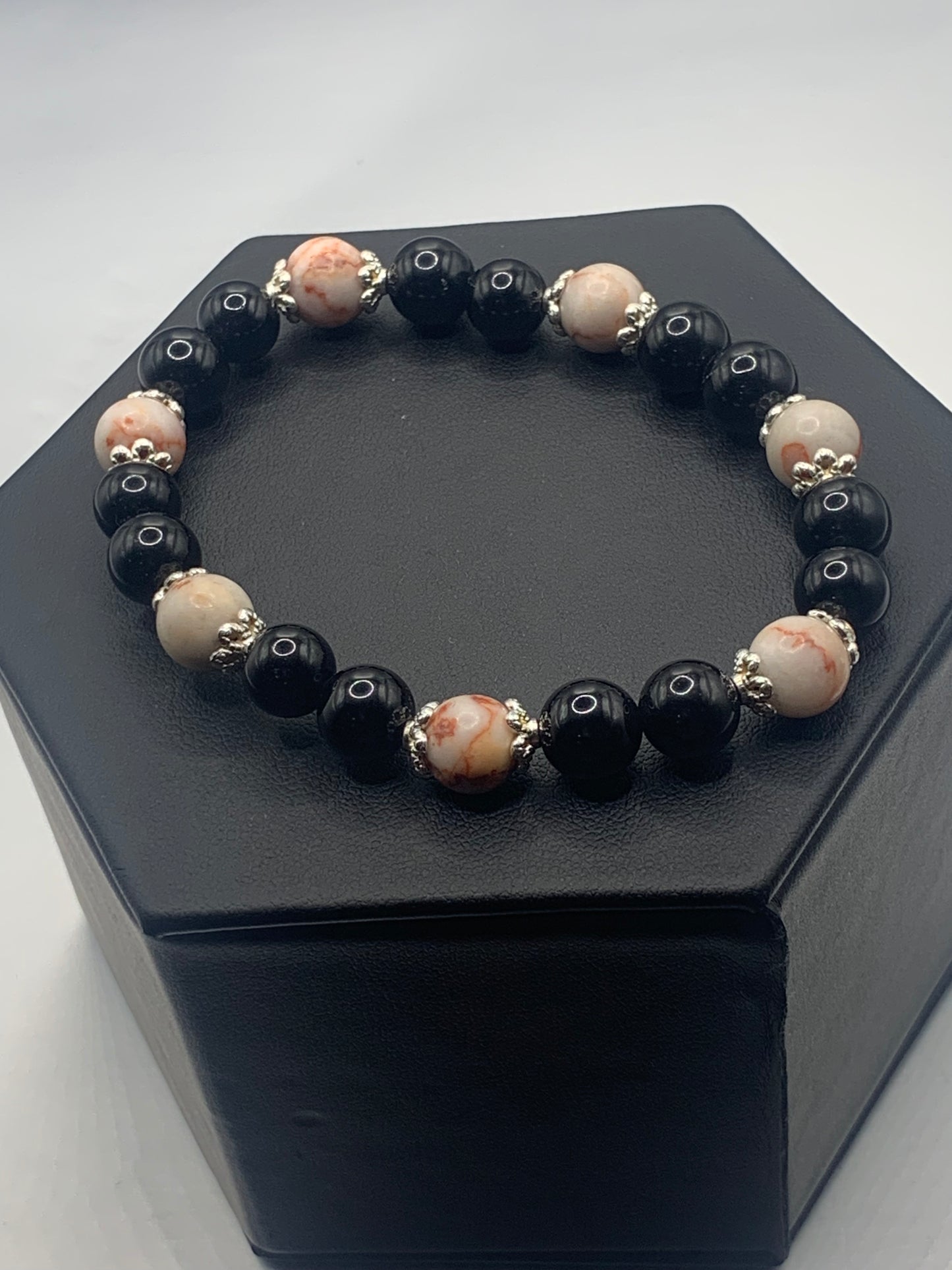 Red vein jasper and black obsidian semi precious stone/crystal elastic beaded bracelet with silver plated flower bead caps