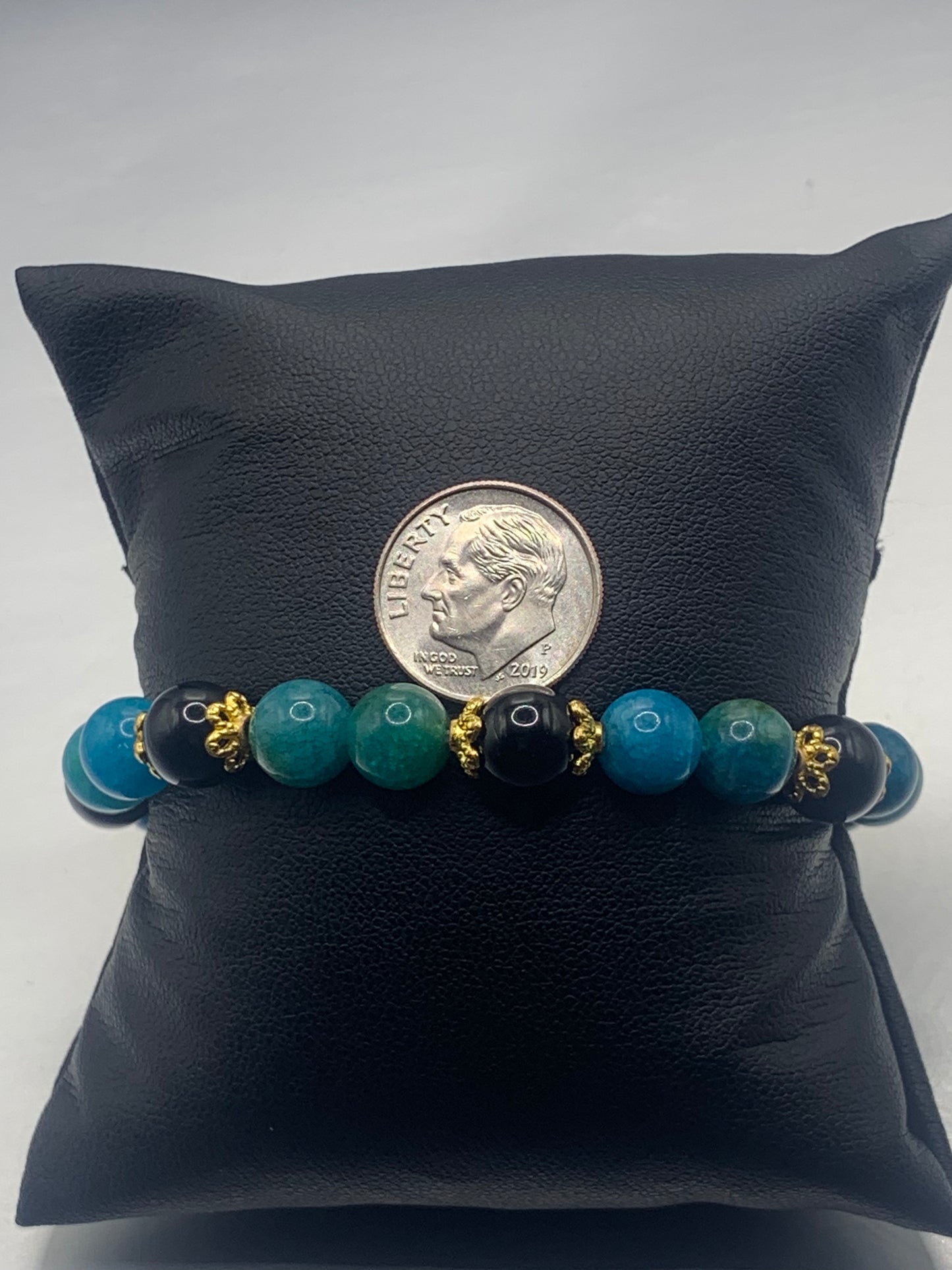 Black obsidian with blue apatite semi precious stone/crystal beaded elastic bracelet with gold plated flower bead caps