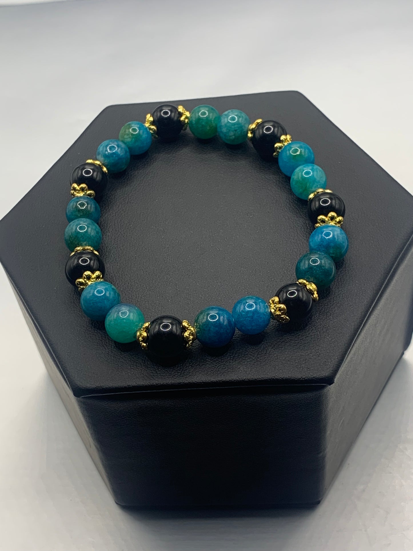 Black obsidian with blue apatite semi precious stone/crystal beaded elastic bracelet with gold plated flower bead caps