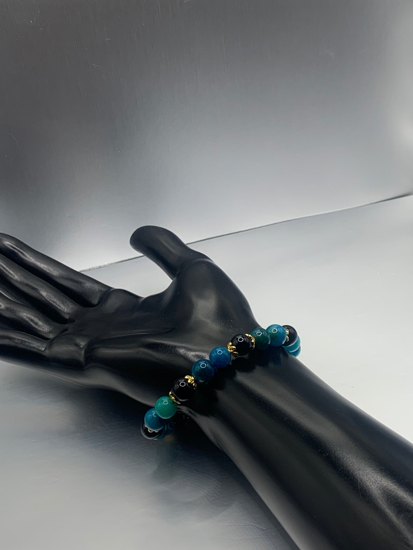 Black obsidian with blue apatite semi precious stone/crystal beaded elastic bracelet with gold plated flower bead caps