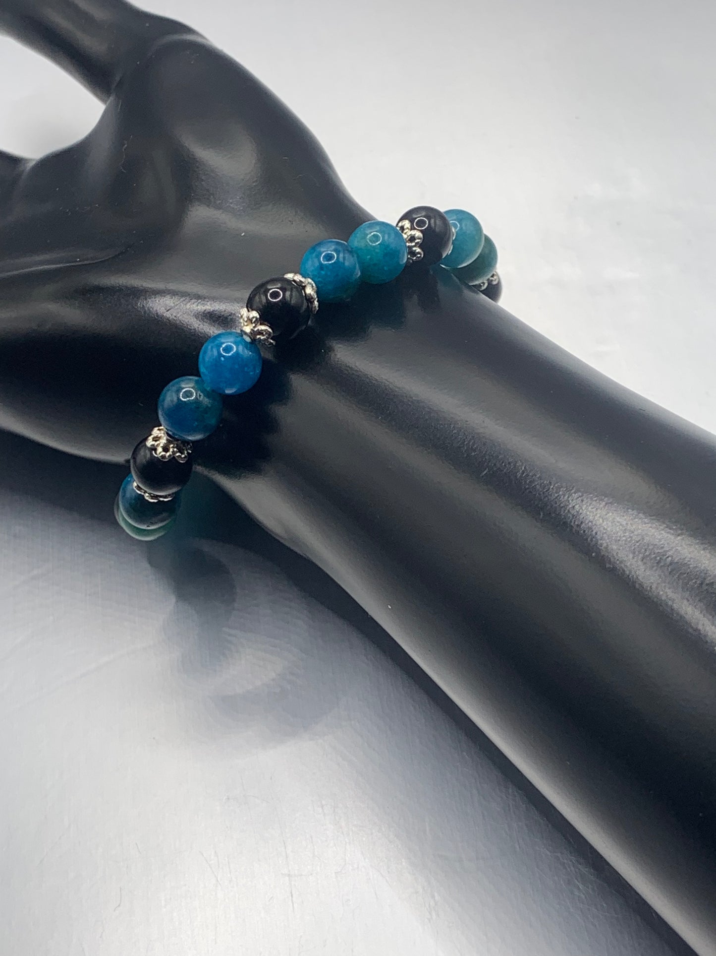 Black obsidian with blue apatite semi precious stone/crystal beaded elastic bracelet with silver plated flower bead caps