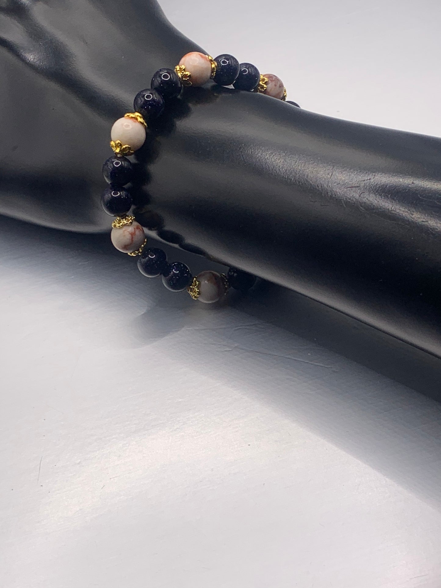 Red vein jasper and blue sandstone semi precious stone/crystal elastic beaded bracelet with gold plated flower bead caps