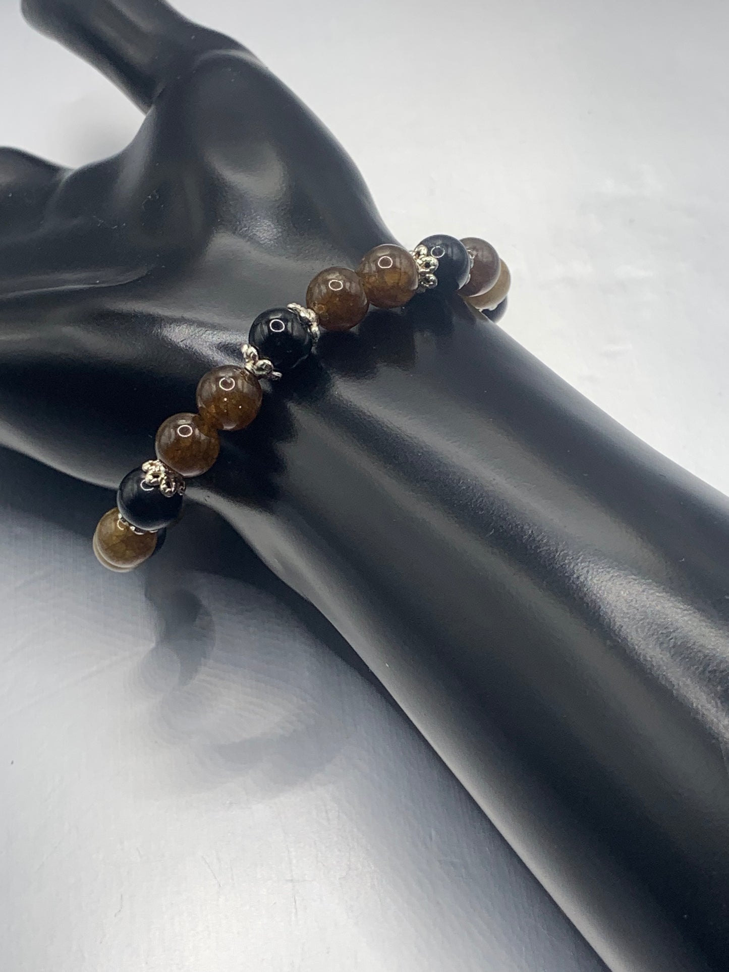 Black obsidian with brown tourmaline semi precious stone/crystal beaded elastic bracelet with silver plated flower bead caps