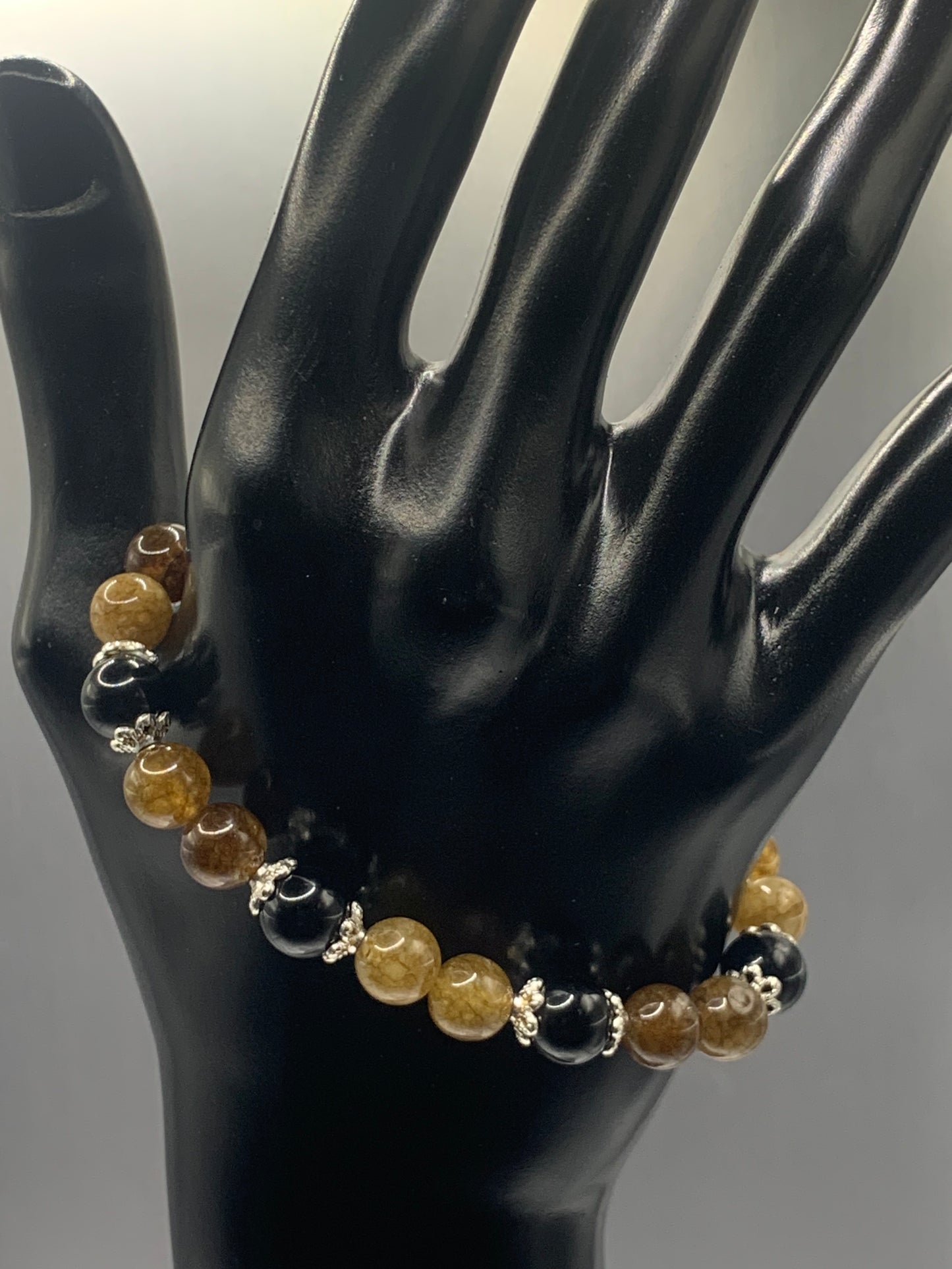Black obsidian with brown tourmaline semi precious stone/crystal beaded elastic bracelet with silver plated flower bead caps