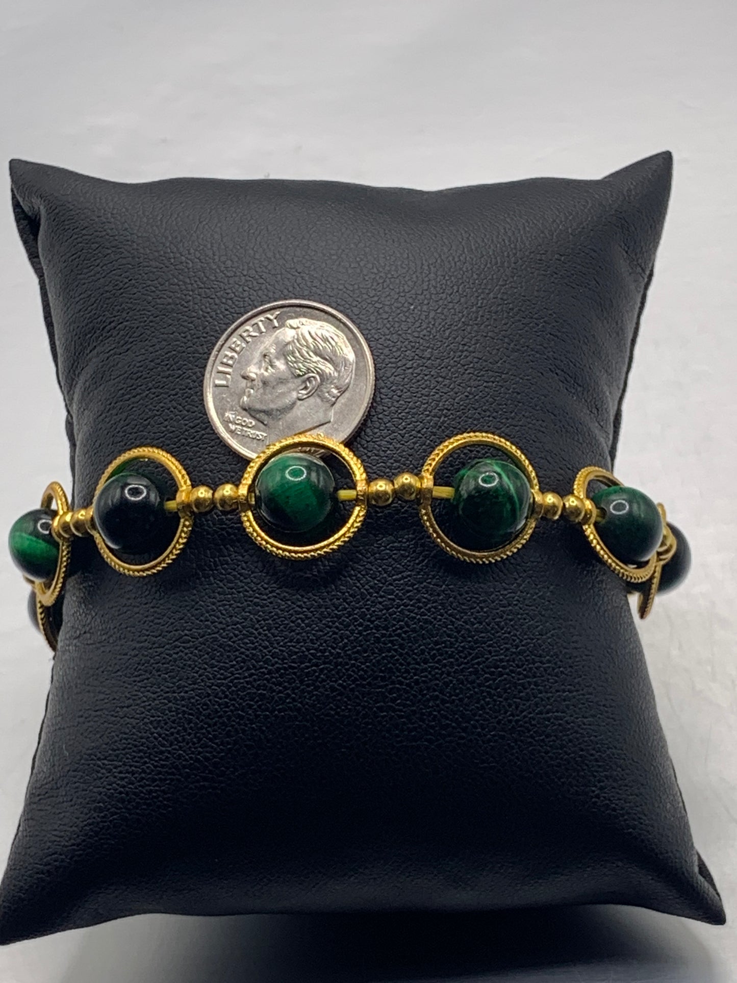 Green tigers eye semi precious stone/crystal elastic beaded bracelet with gold colored rings