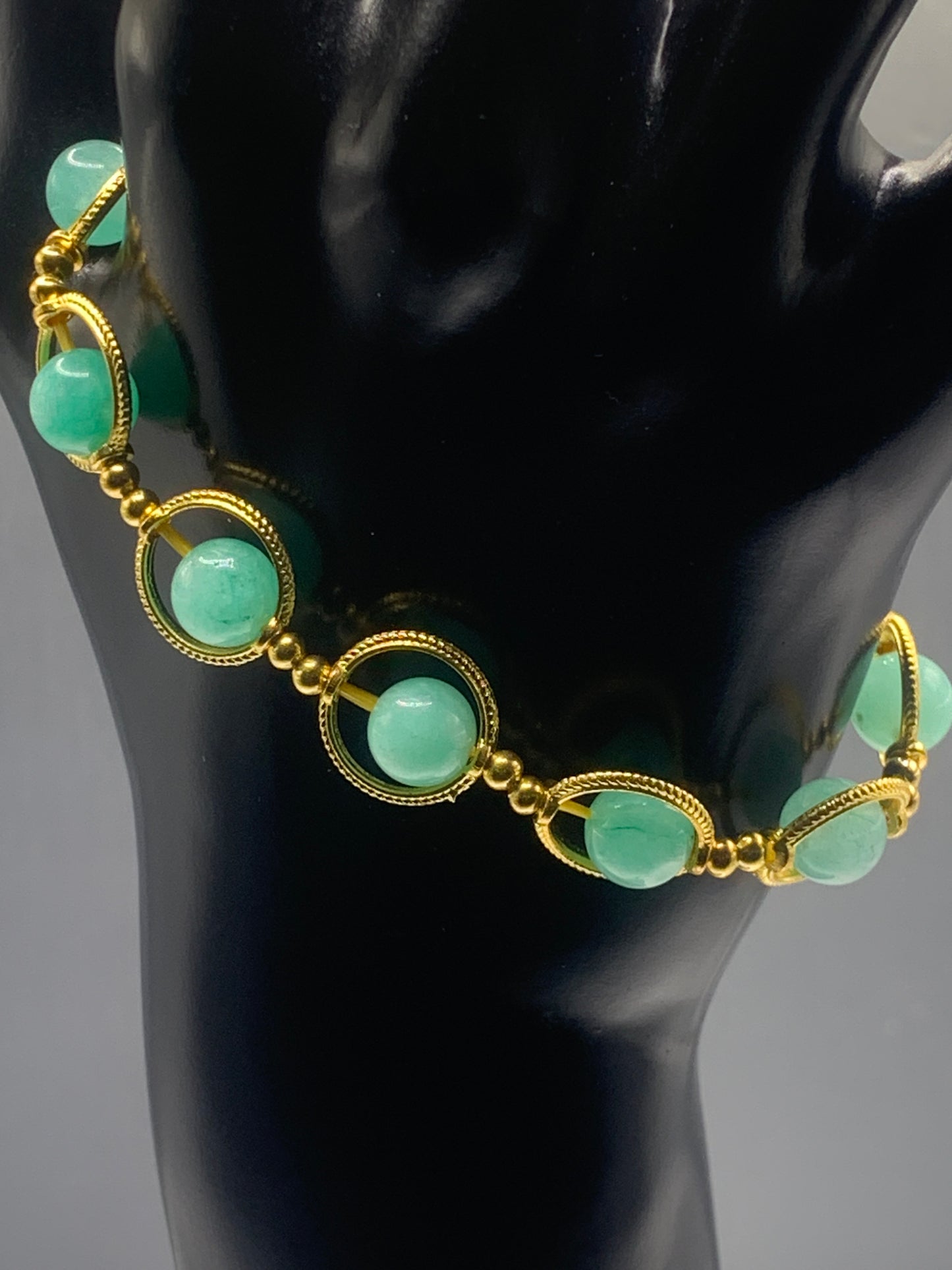 Teal chalcedony semi precious stone/crystal elastic beaded bracelet with gold colored rings