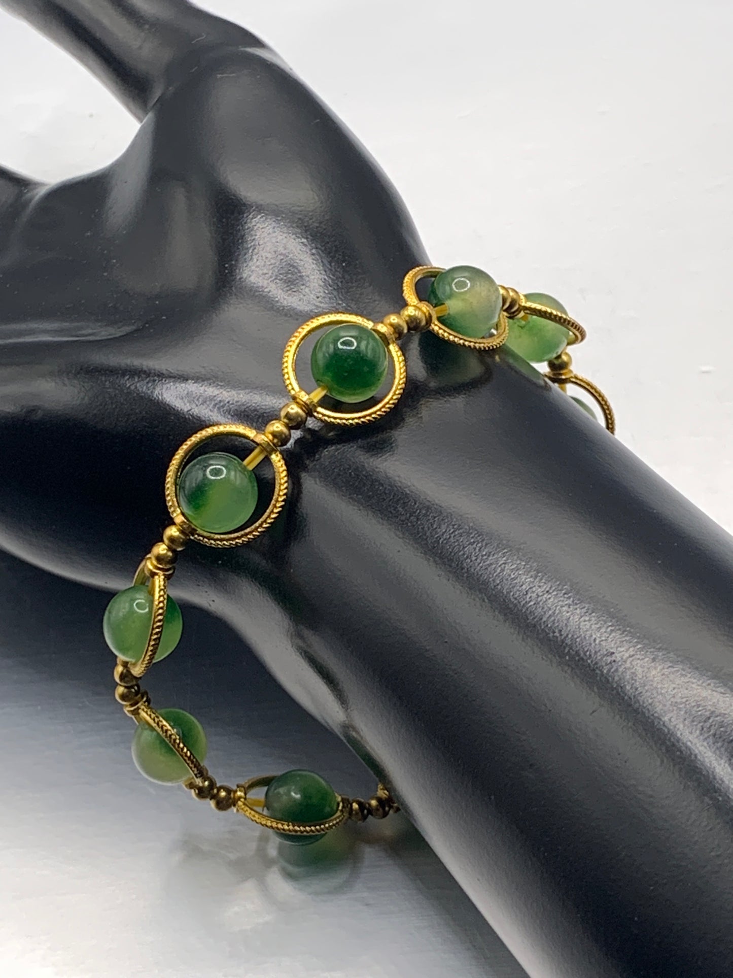 Green agate semi precious stone/crystal elastic beaded bracelet with gold colored rings