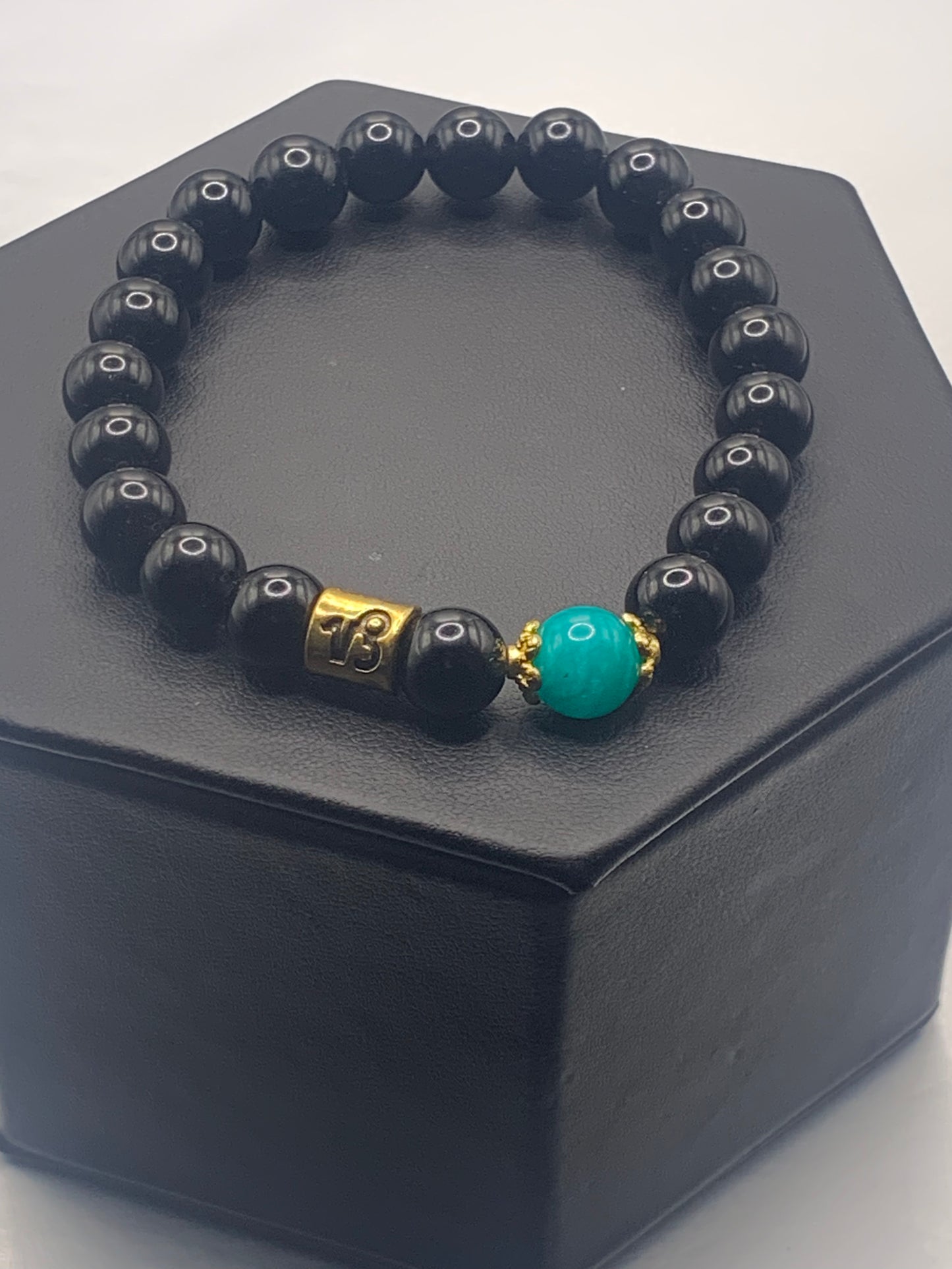 Capricorn Zodiac black obsidian with aquamarine chalcedony elastic beaded bracelet with gold accents