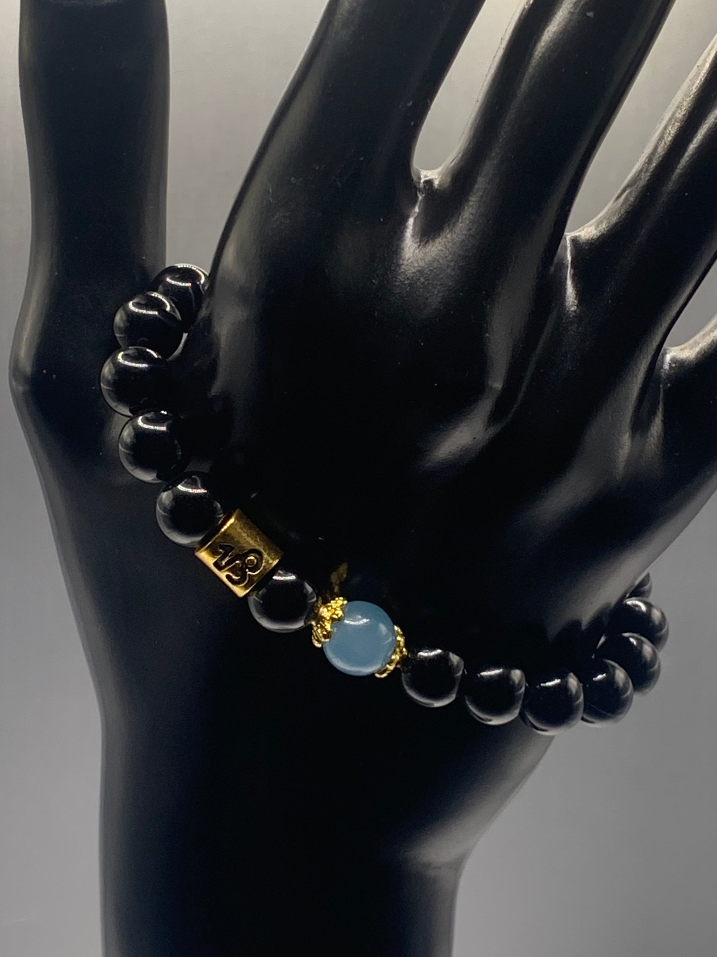 Capricorn Zodiac black obsidian with blue agate elastic beaded bracelet with gold accents