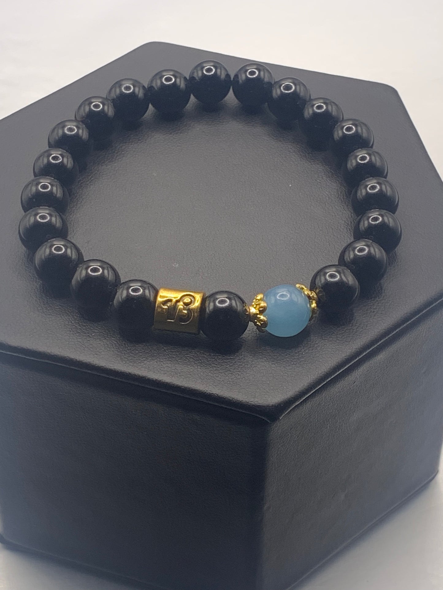 Capricorn Zodiac black obsidian with blue agate elastic beaded bracelet with gold accents