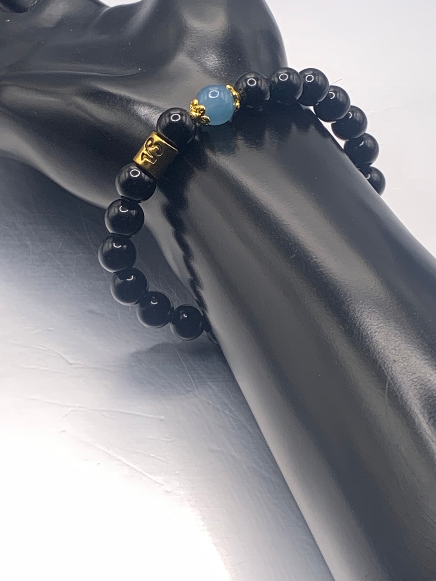 Capricorn Zodiac black obsidian with blue agate elastic beaded bracelet with gold accents