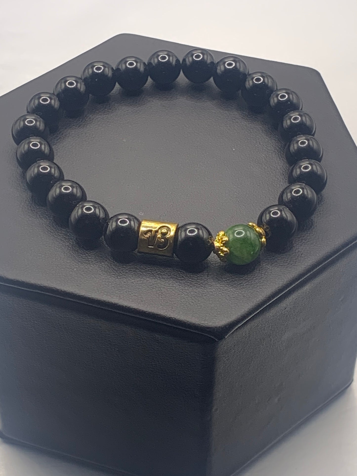 Capricorn Zodiac black obsidian with green tourmaline elastic beaded bracelet with gold accents