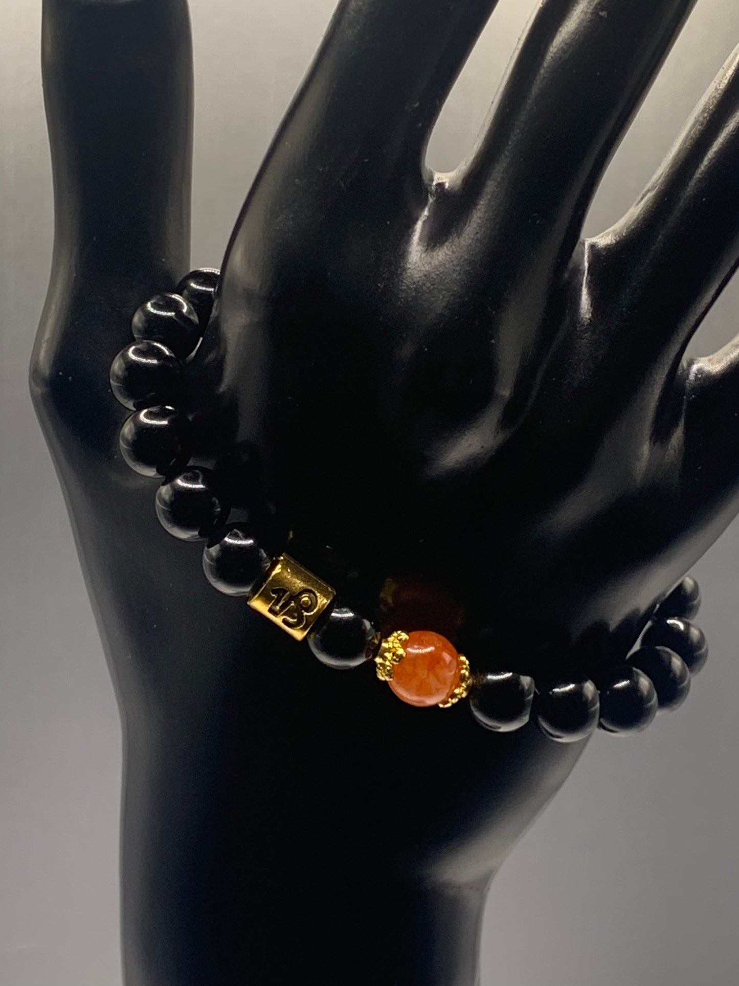 Capricorn Zodiac black obsidian with phoenix agate elastic beaded bracelet with gold accents